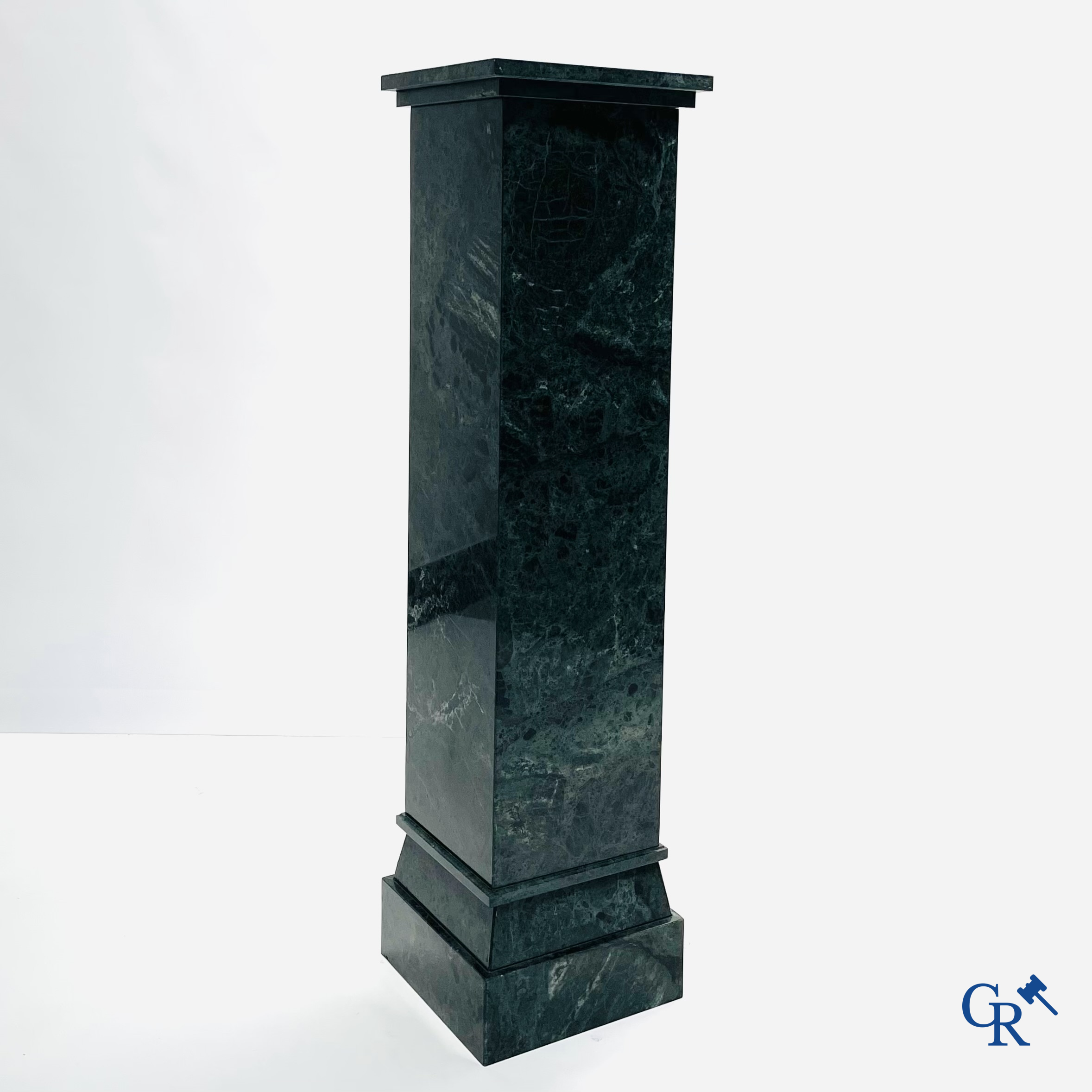 A large pedestal in green marble. 20th century.