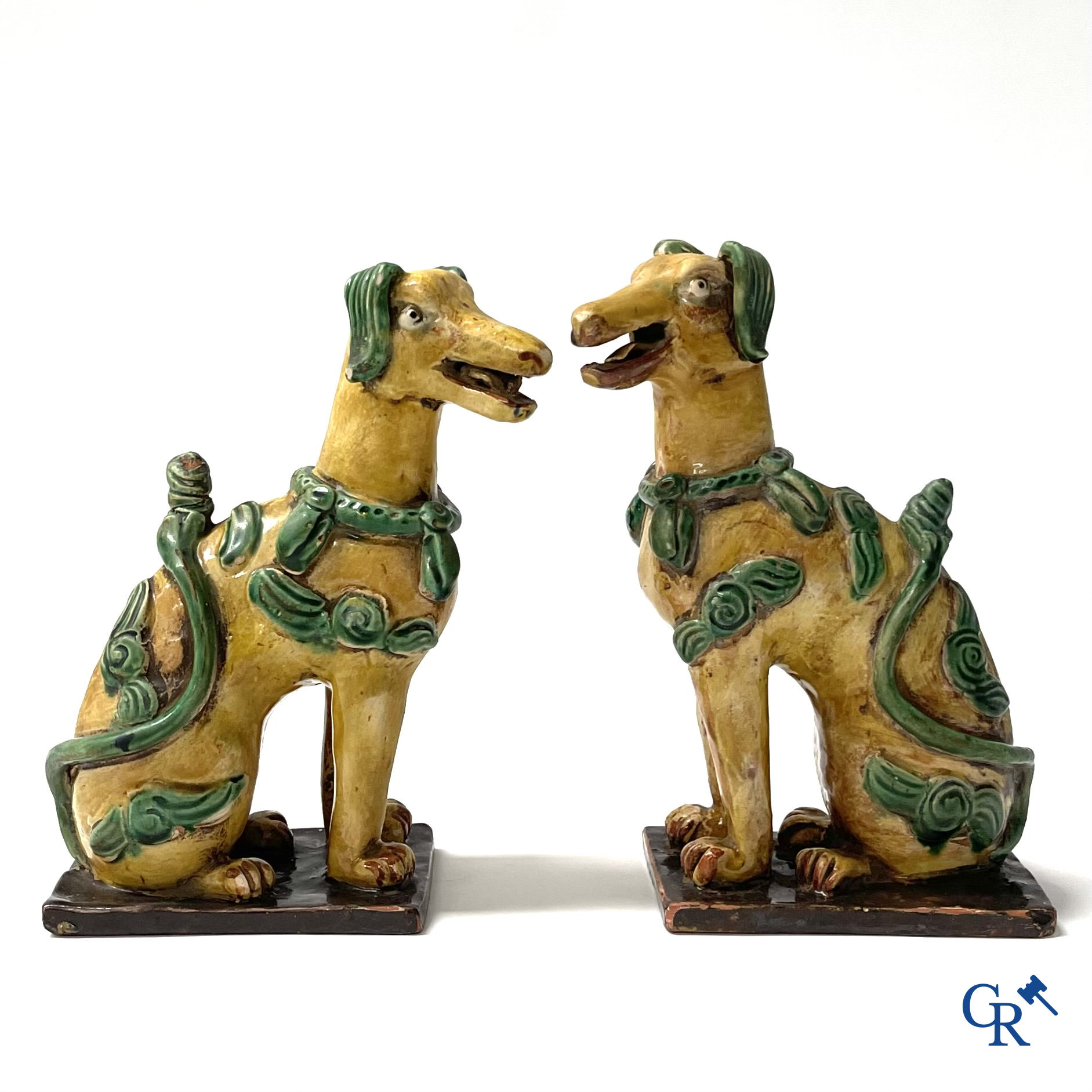 Asian Art, Chine. A pair of seated enamelled terra cotta dogs. 18th-19th century.