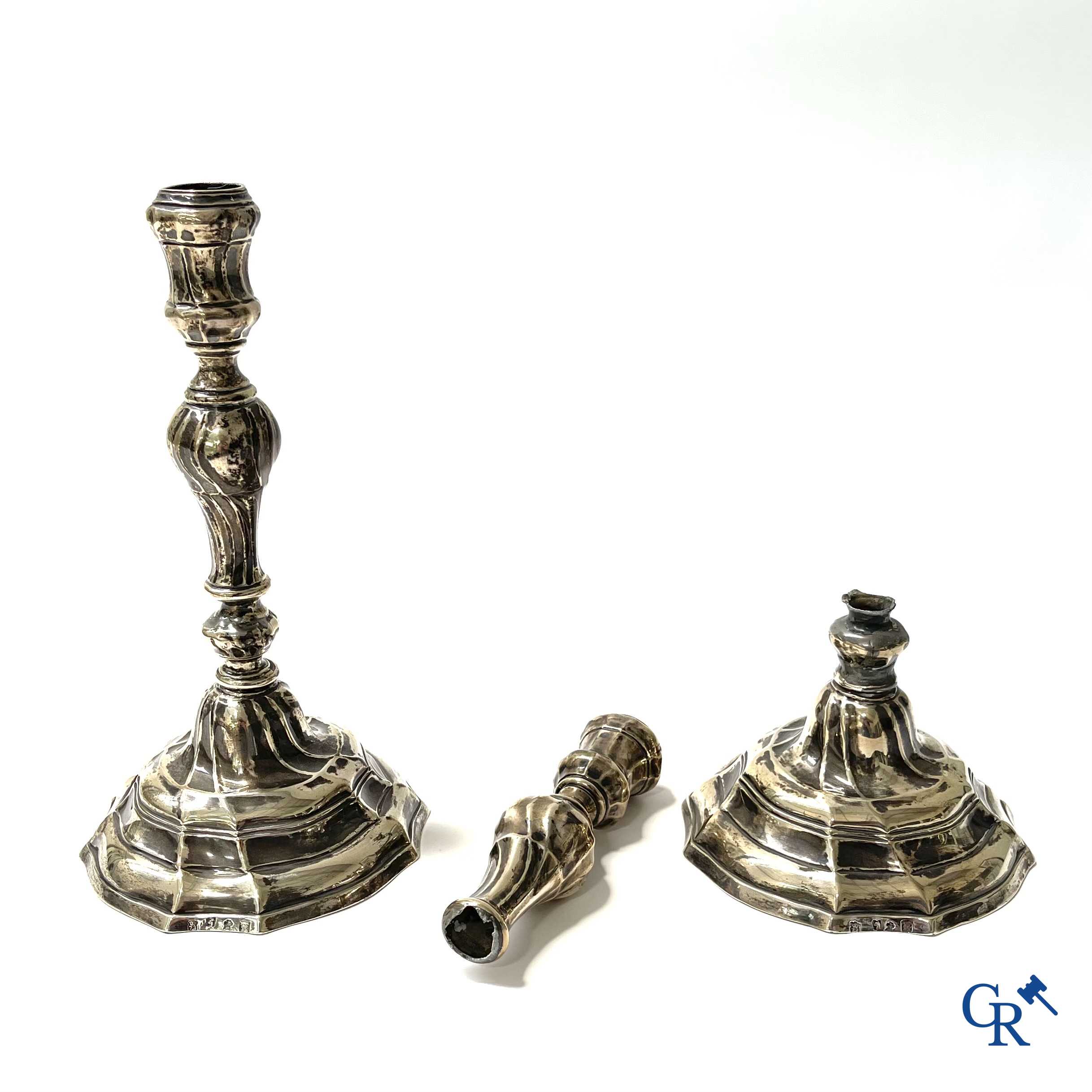 Silver. A pair of 18th century silver candlesticks. Multiple hallmarks.