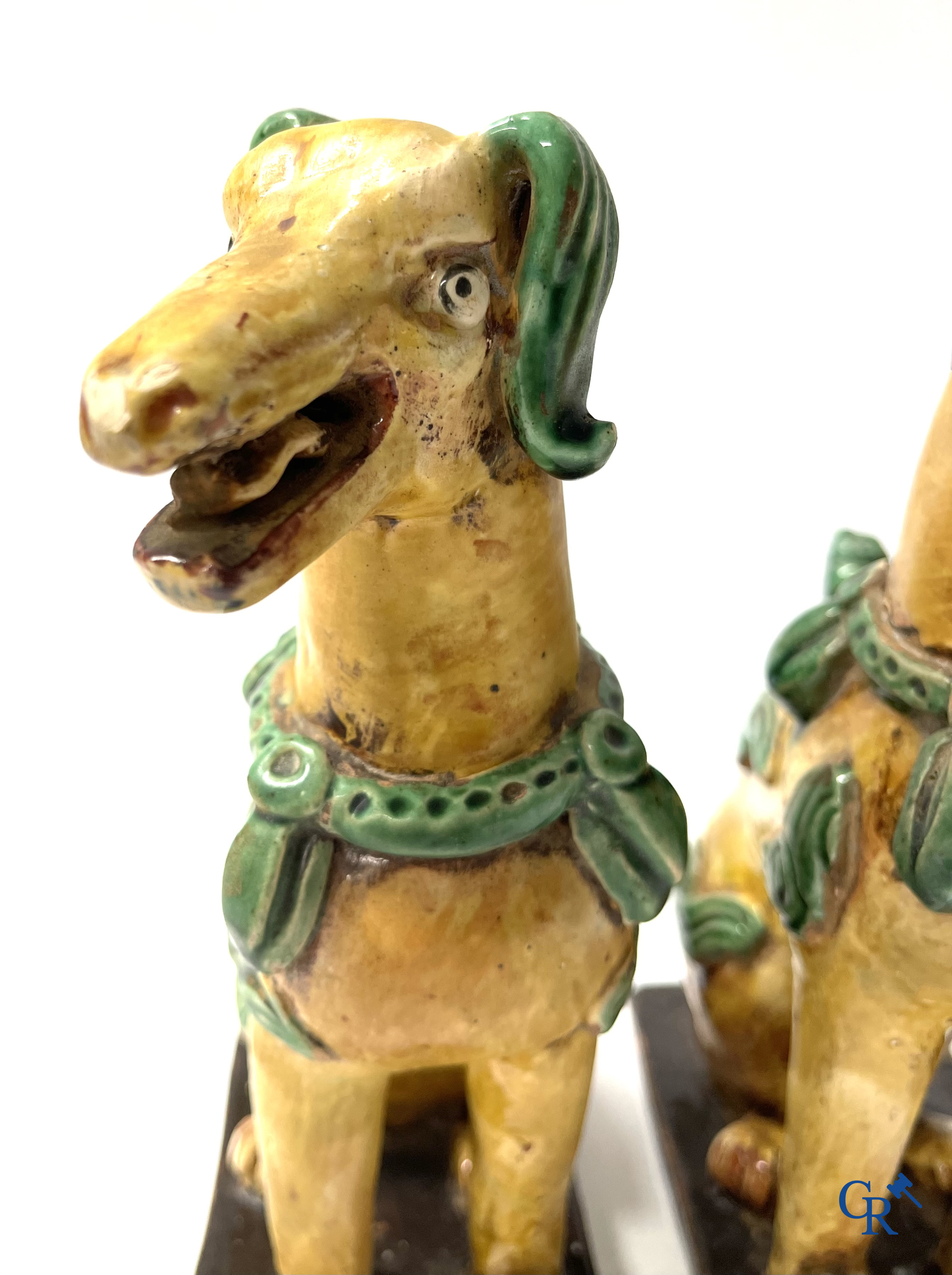 Asian Art, Chine. A pair of seated enamelled terra cotta dogs. 18th-19th century.