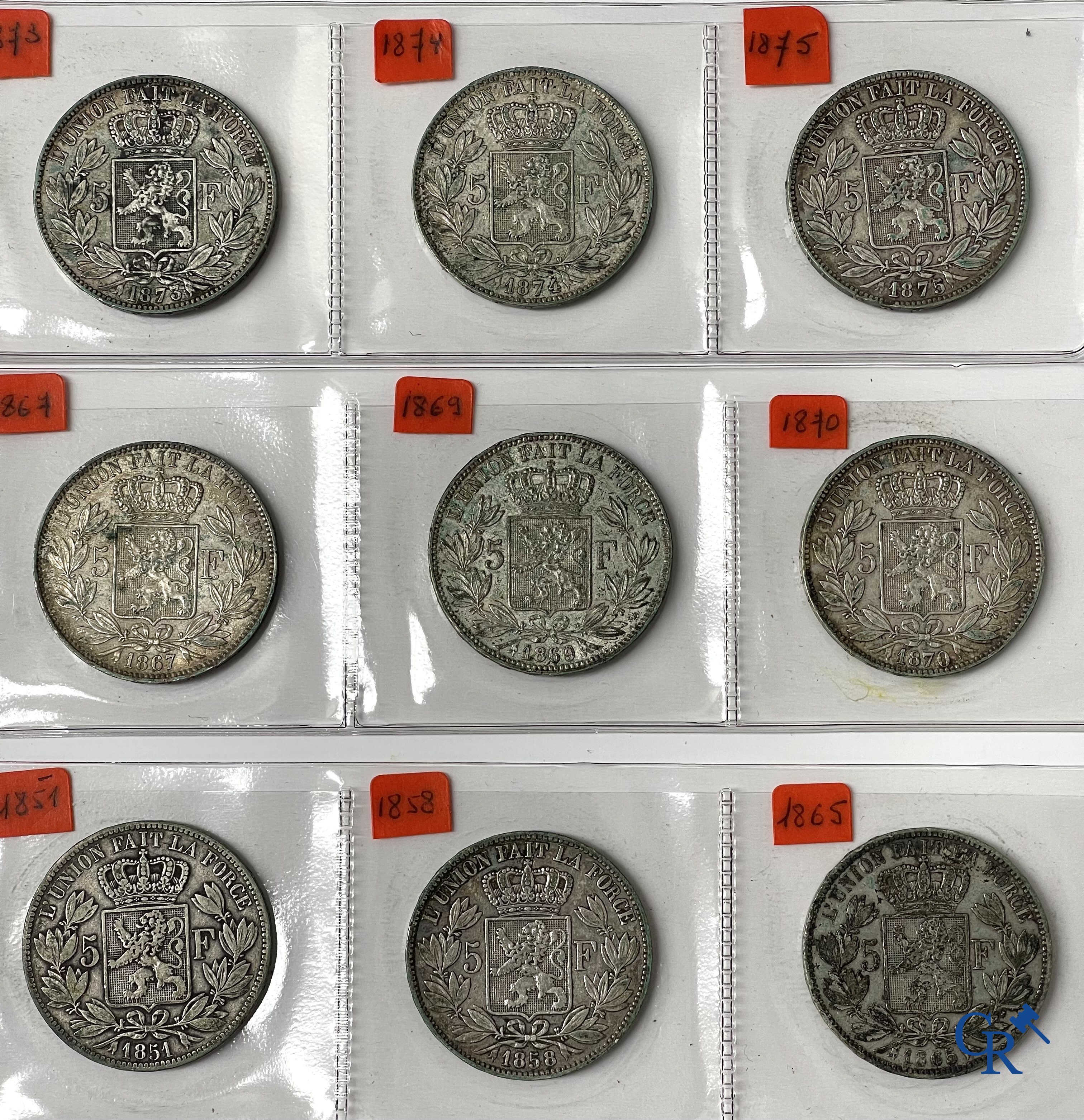 Old coins and banknotes. A large collection of old coins and banknotes. Multiple coins in silver.