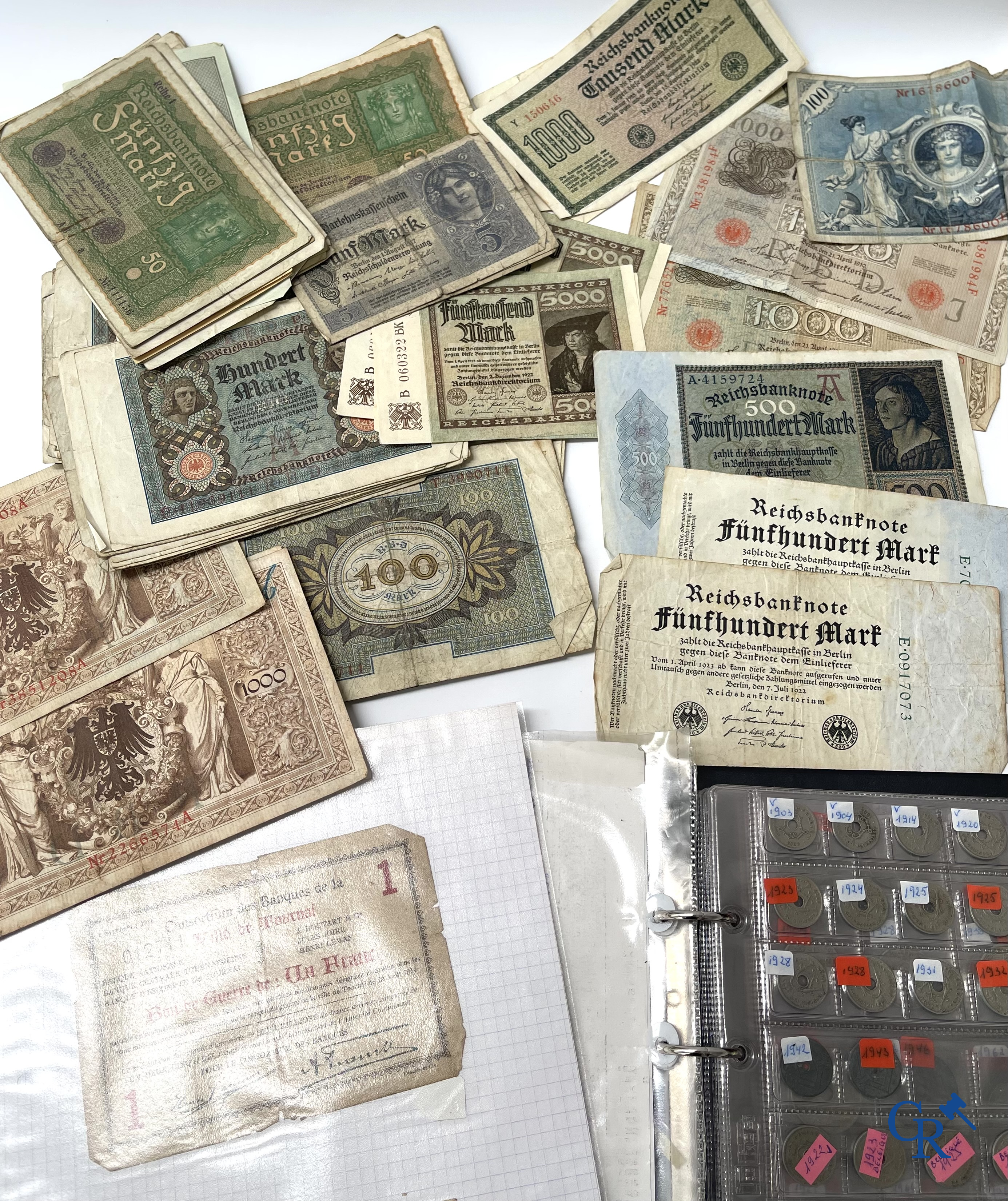 Old coins and banknotes. A large collection of old coins and banknotes. Multiple coins in silver.
