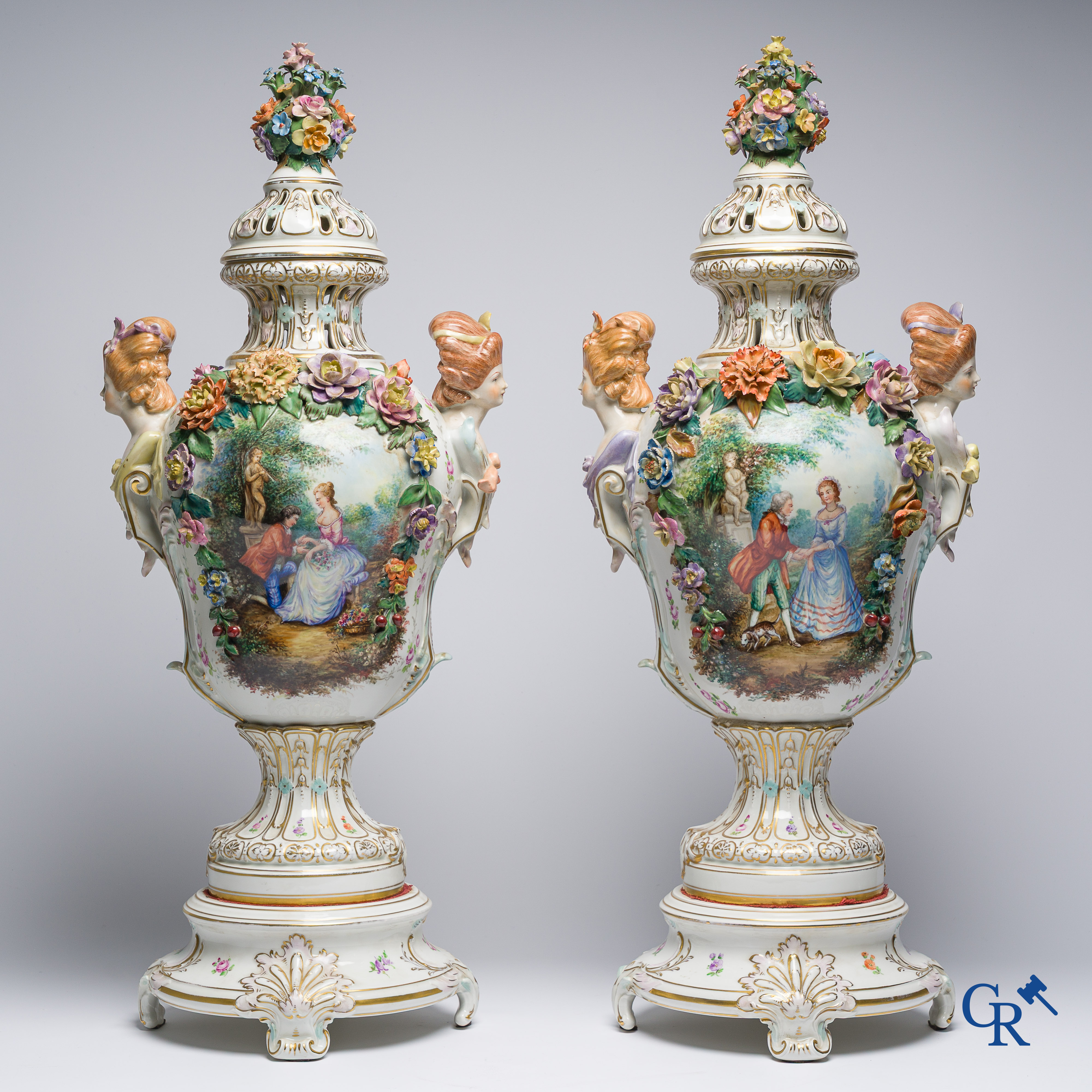 Dresden, German porcelain. Pair of large lid vases with romantic scenes. On base. Marked and numbered.