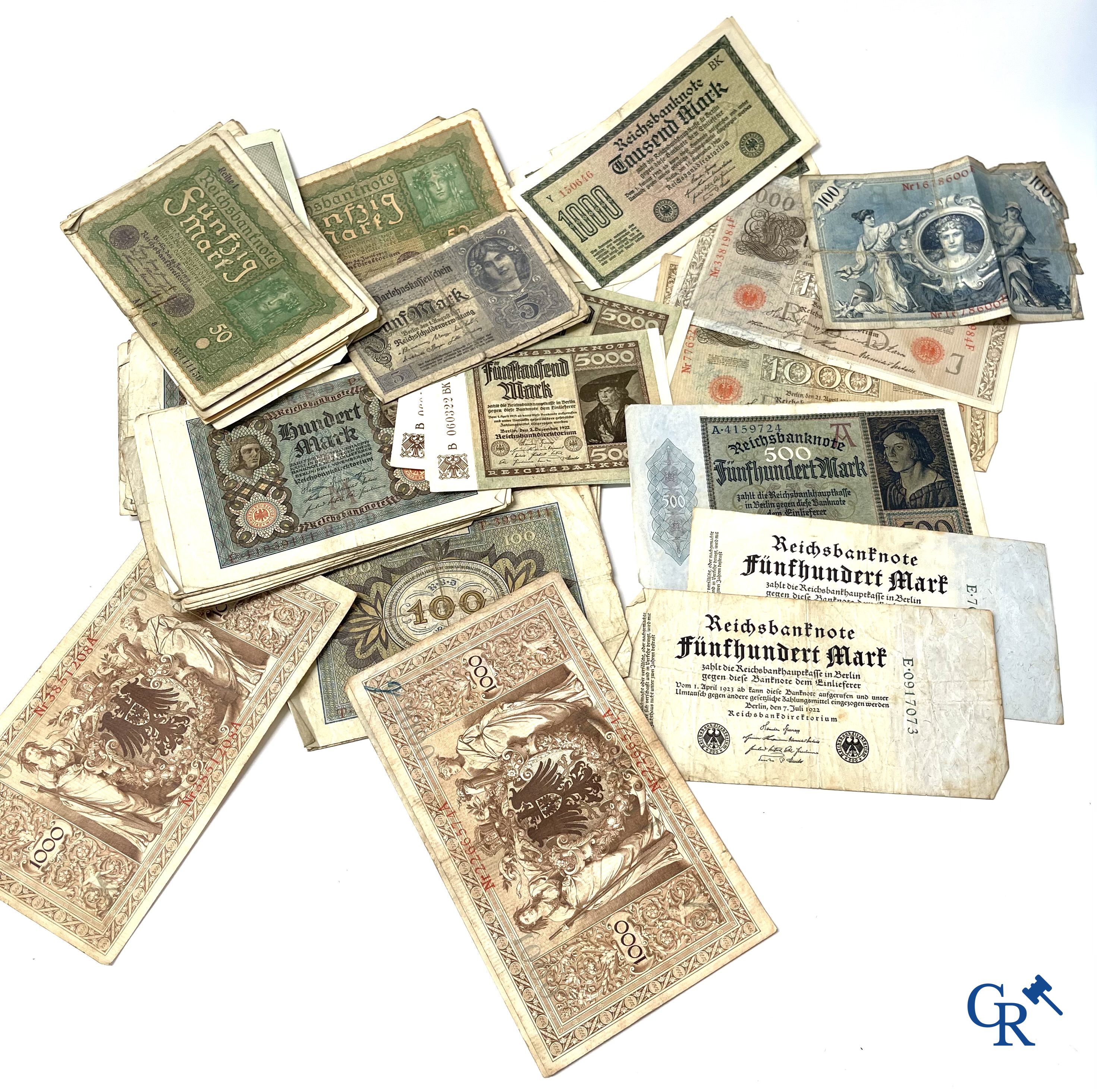 Old coins and banknotes. A large collection of old coins and banknotes. Multiple coins in silver.