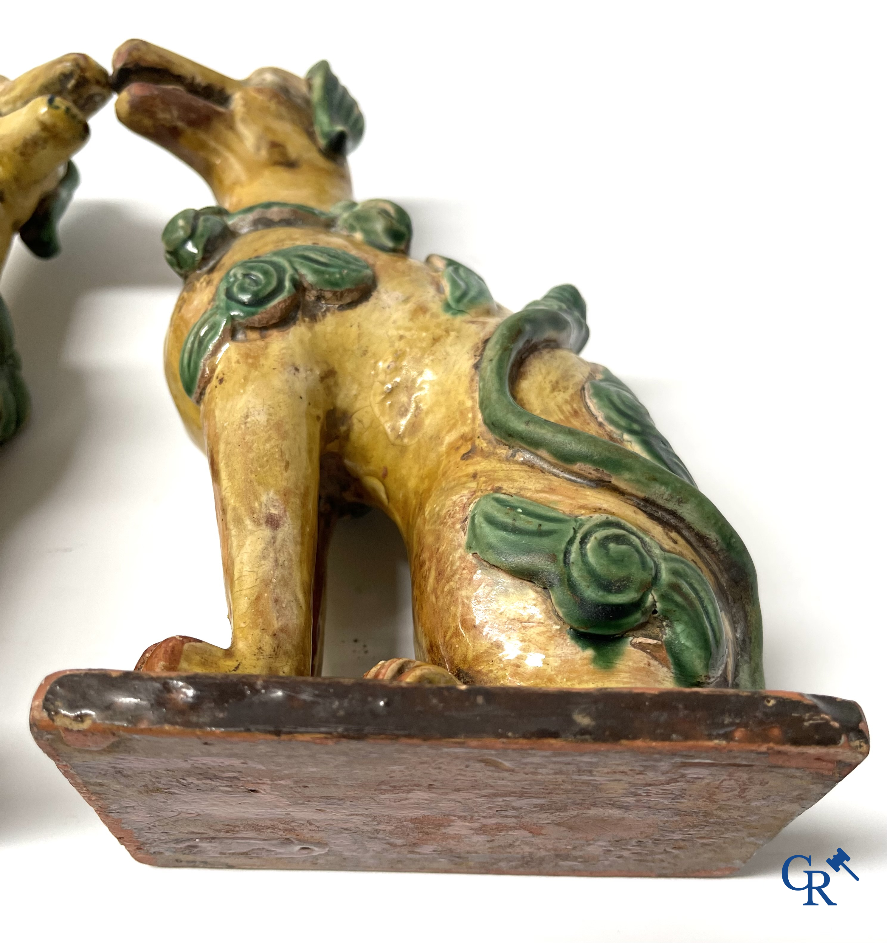 Asian Art, Chine. A pair of seated enamelled terra cotta dogs. 18th-19th century.