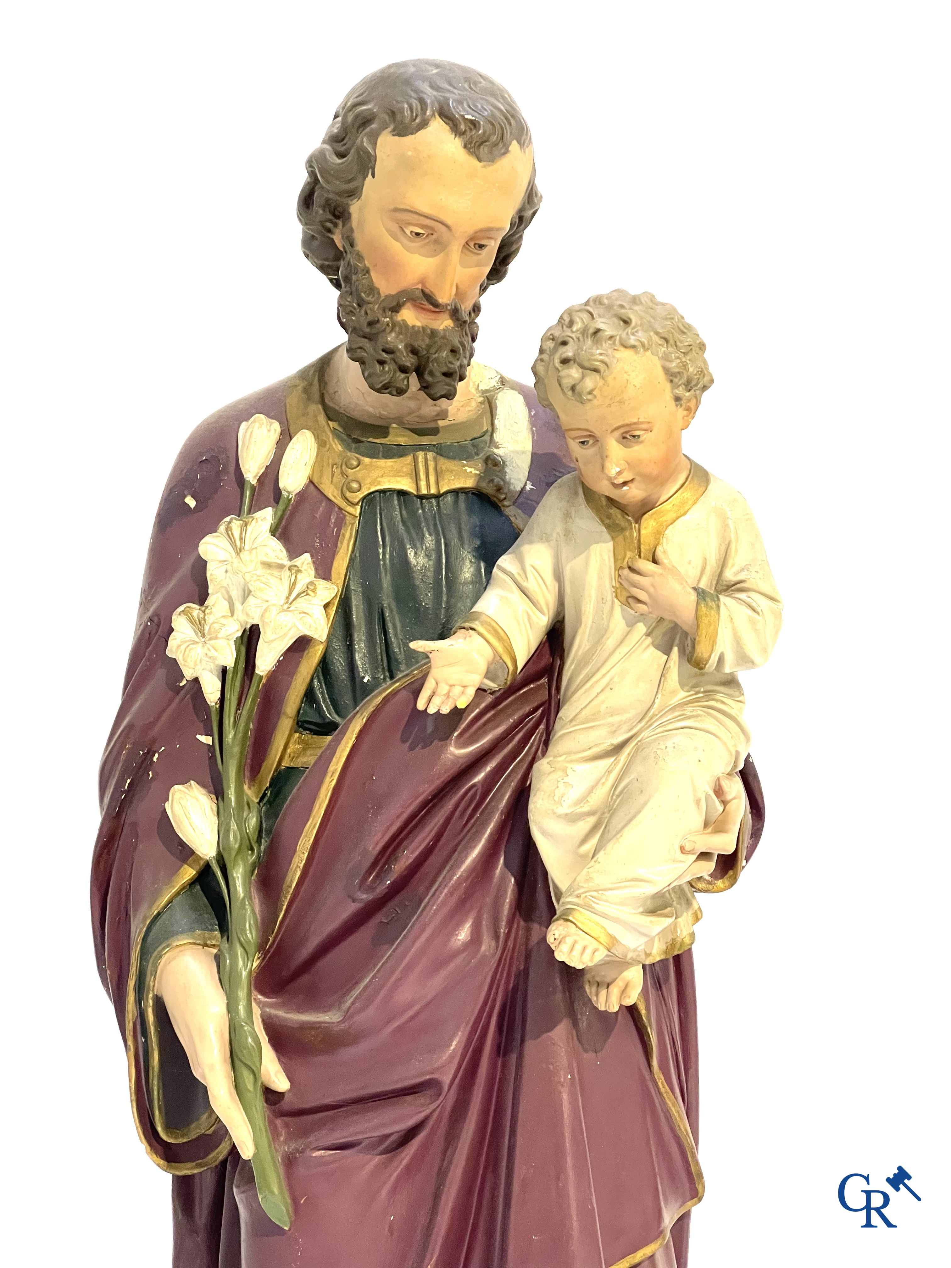 A large bronze candlestick, Saint Joseph with child in plaster, a terracotta bust of Christ and a holy water vessel.