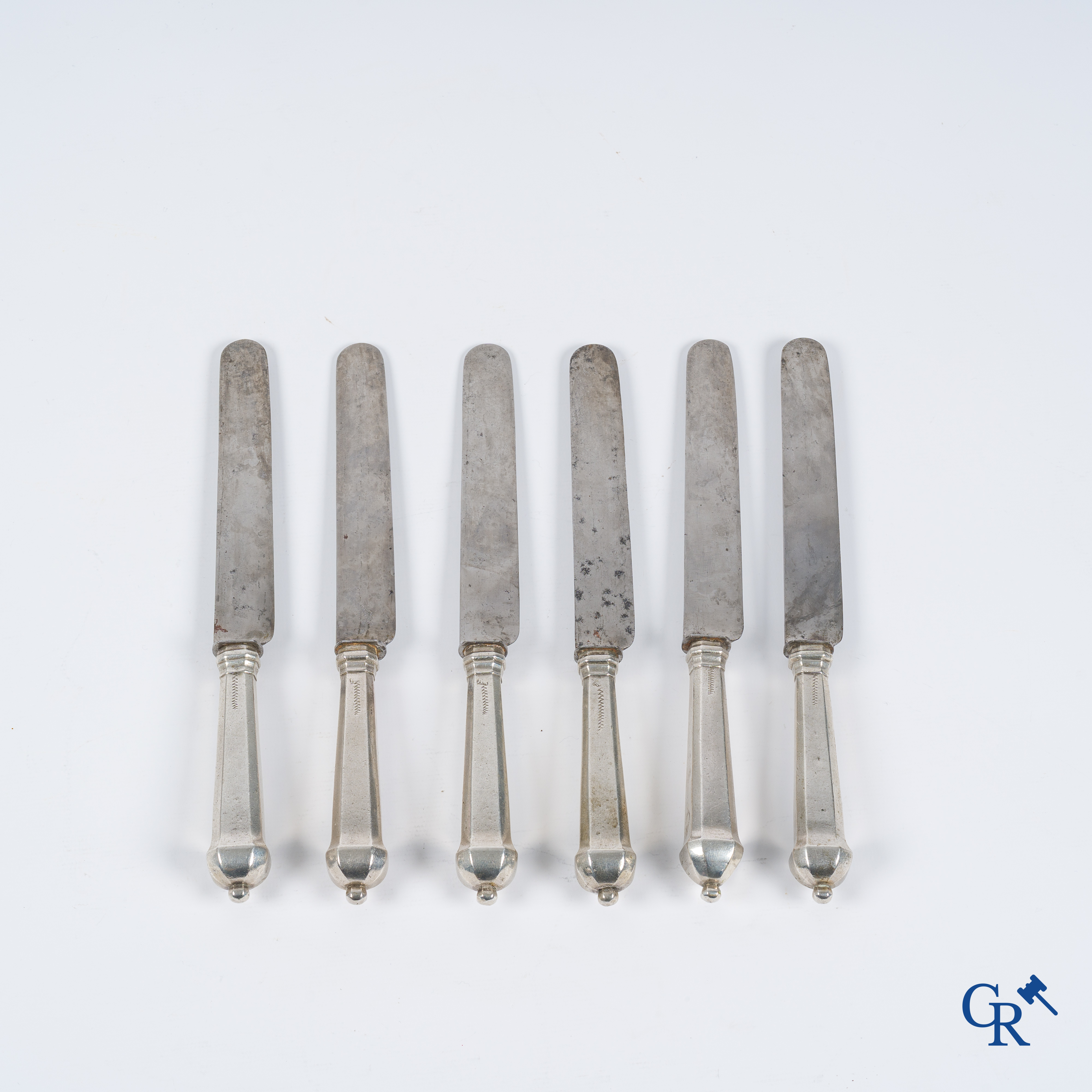 Silver. Set of 6 knives with silver handles decorated with coats of arms. Most probably Liège, 18th century.