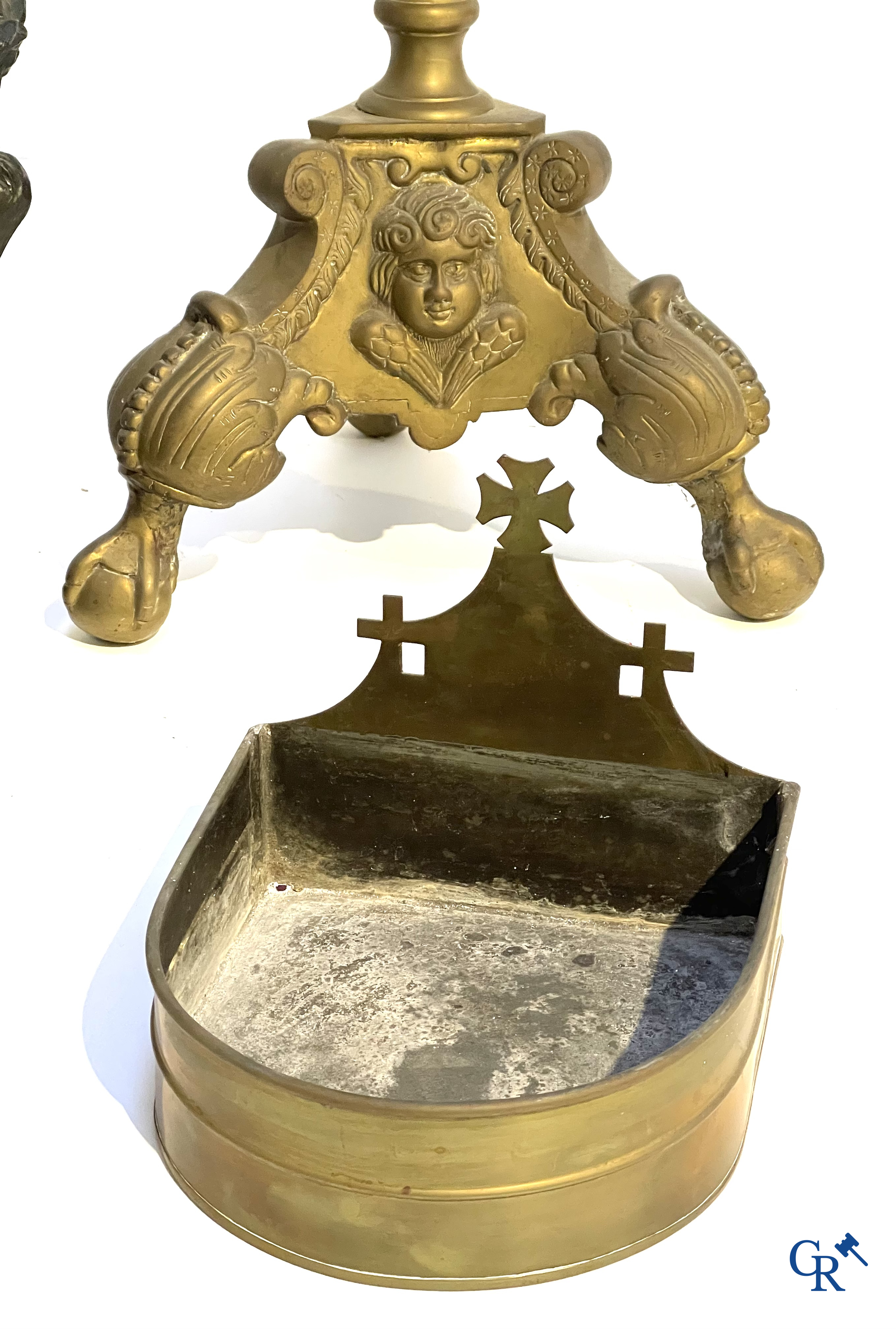 A large bronze candlestick, Saint Joseph with child in plaster, a terracotta bust of Christ and a holy water vessel.