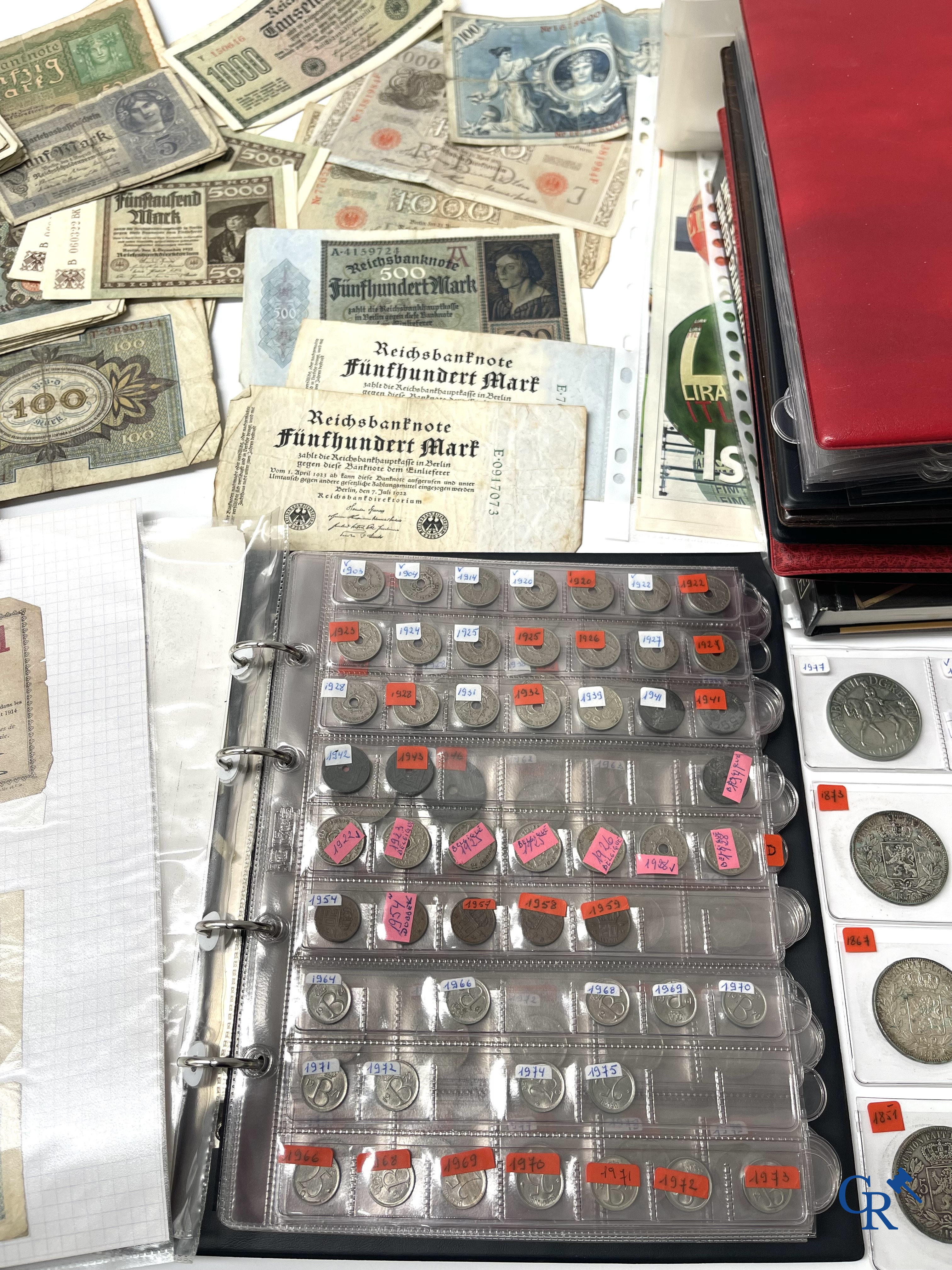 Old coins and banknotes. A large collection of old coins and banknotes. Multiple coins in silver.