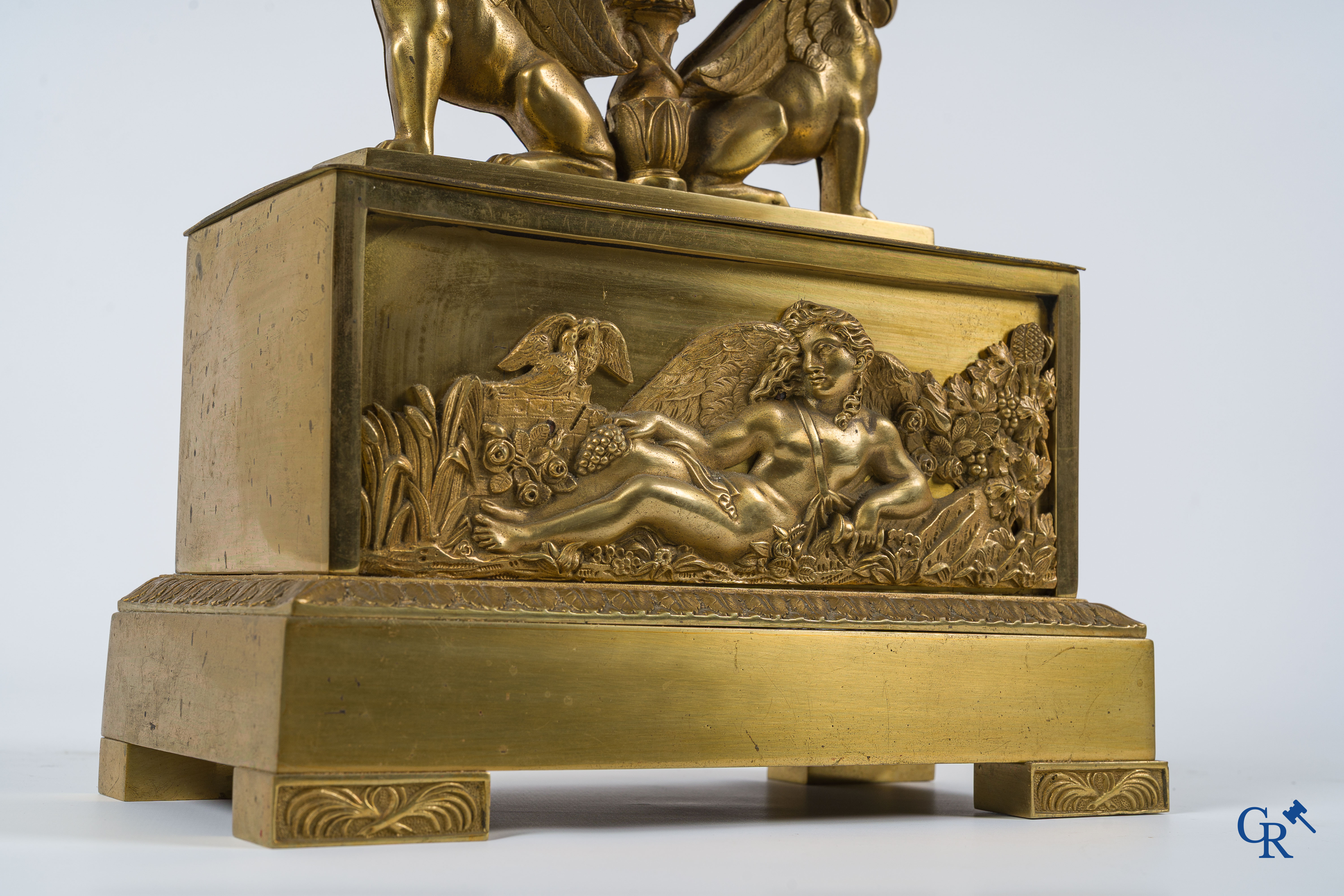 Charles X period. Beautiful pendulum in gilded bronze, a lyre held up by griffins. France, circa 1825.