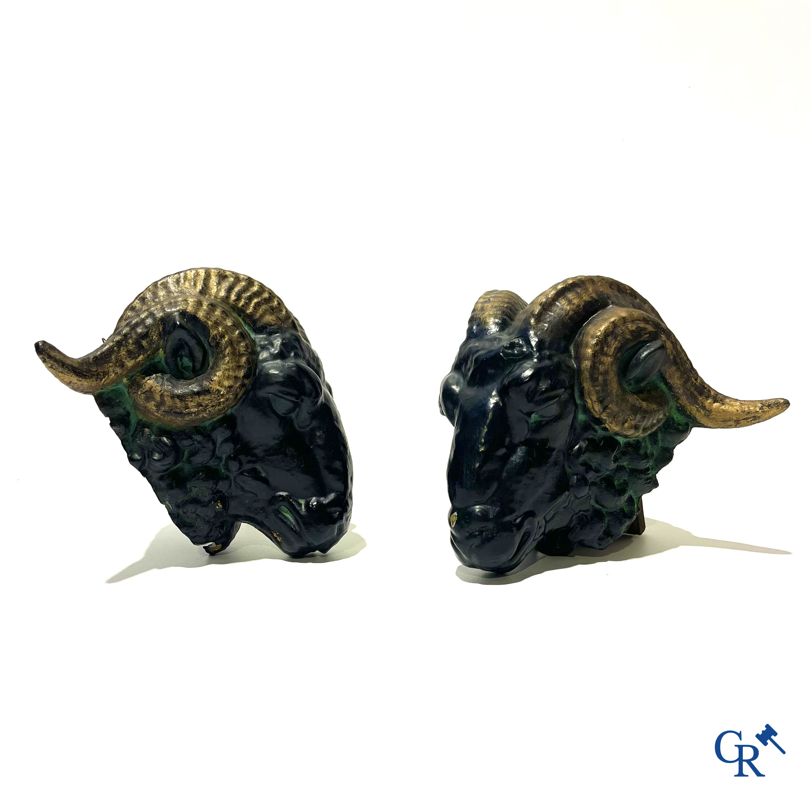 Butchery signboard. Pair of ram heads in zinc serving as façade decoration for a butchery. Circa 1900-1930.