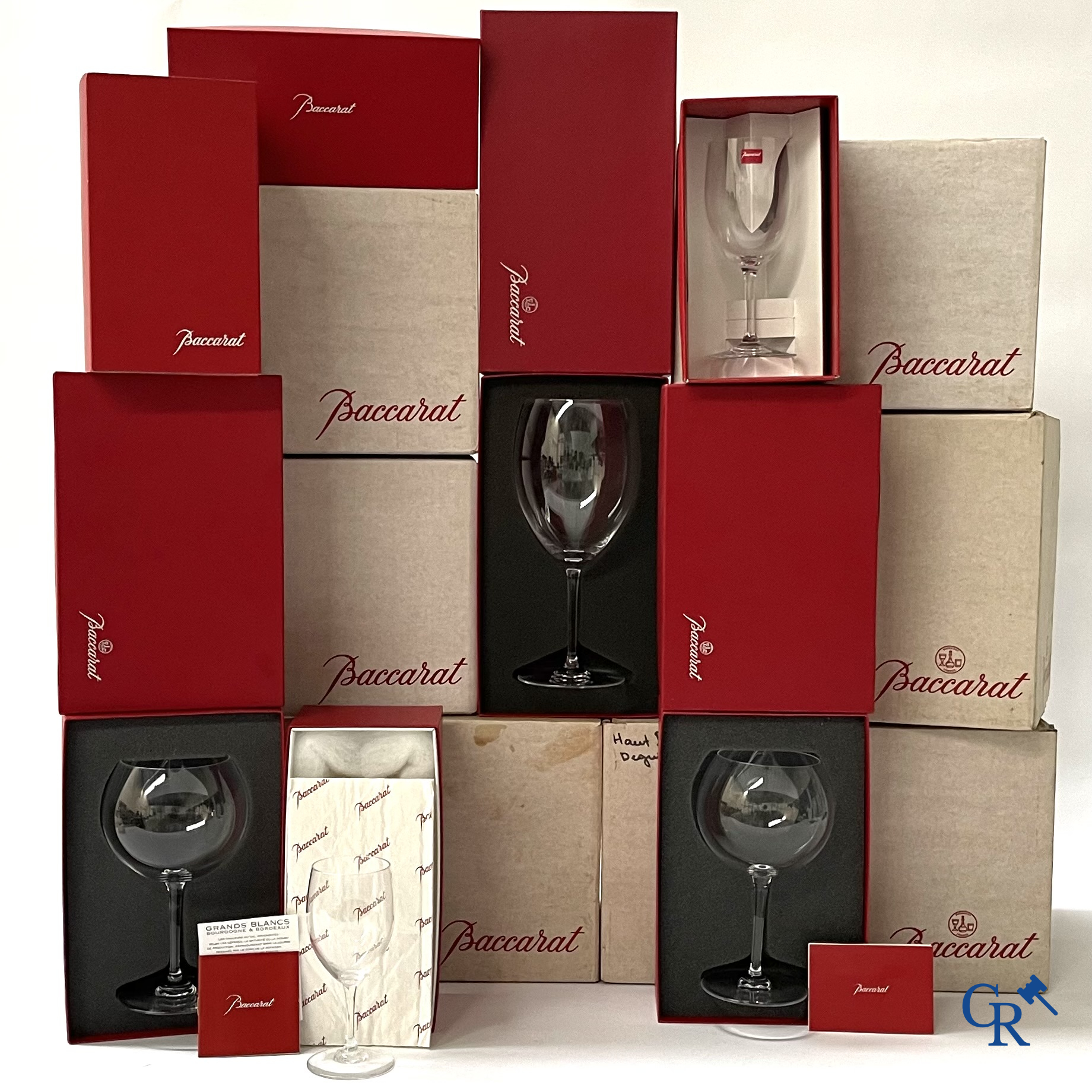 Baccarat France. A large lot (87 pieces) with crystal glasses. Mostly in the original box. Signed.
