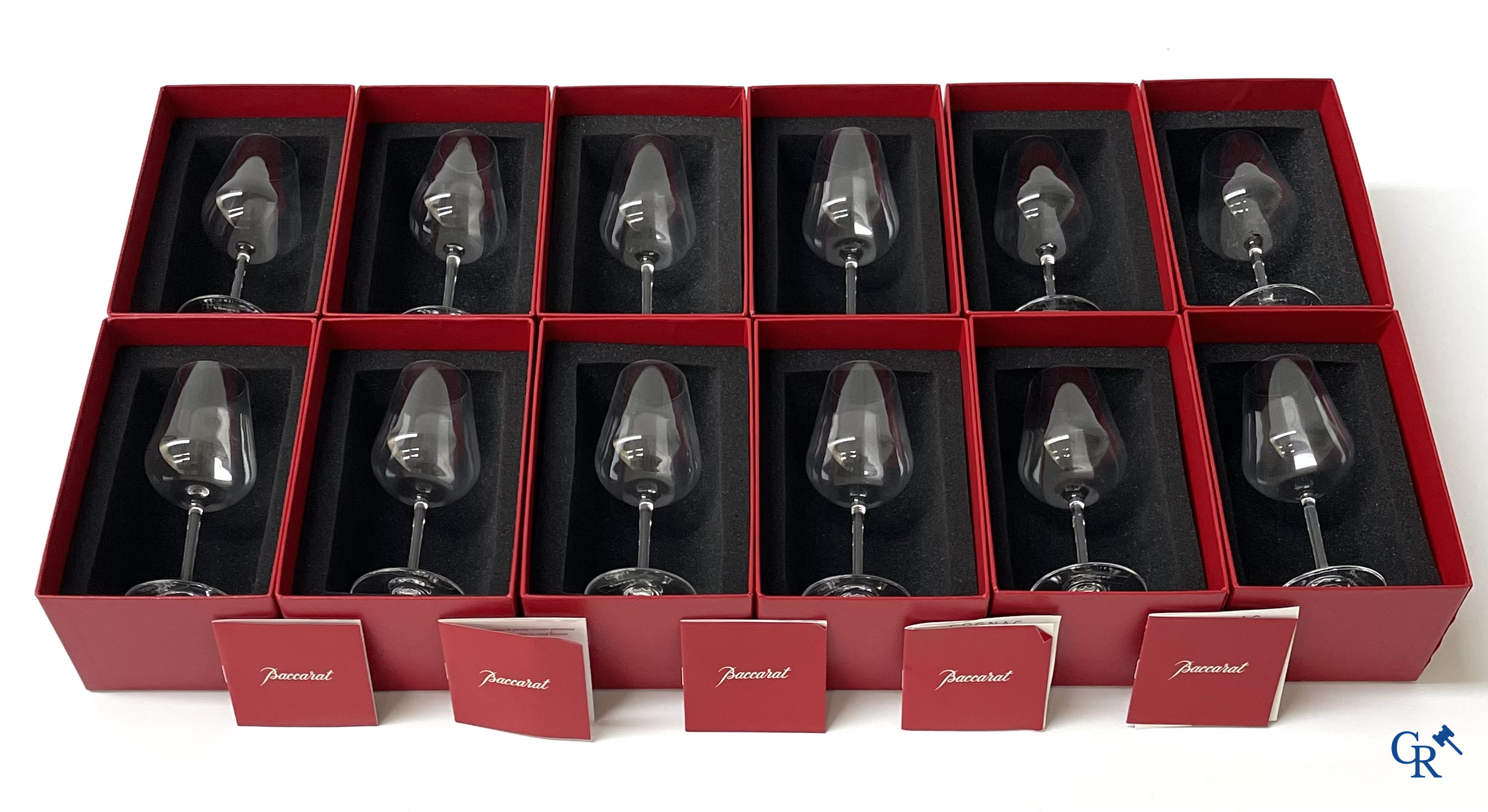 Baccarat. A set of 12 crystal cognac glasses in their original red box. Signed. New condition.