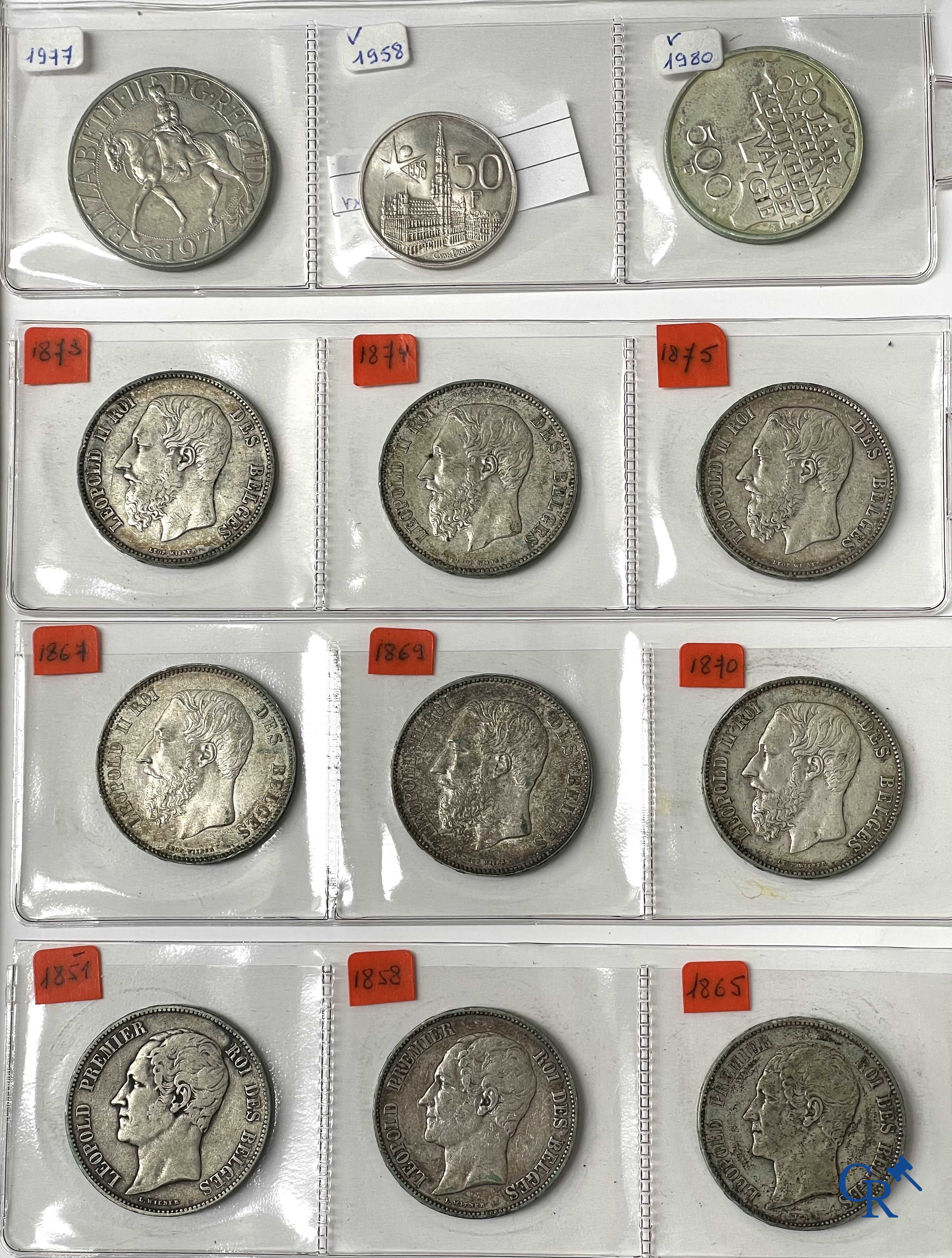 Old coins and banknotes. A large collection of old coins and banknotes. Multiple coins in silver.
