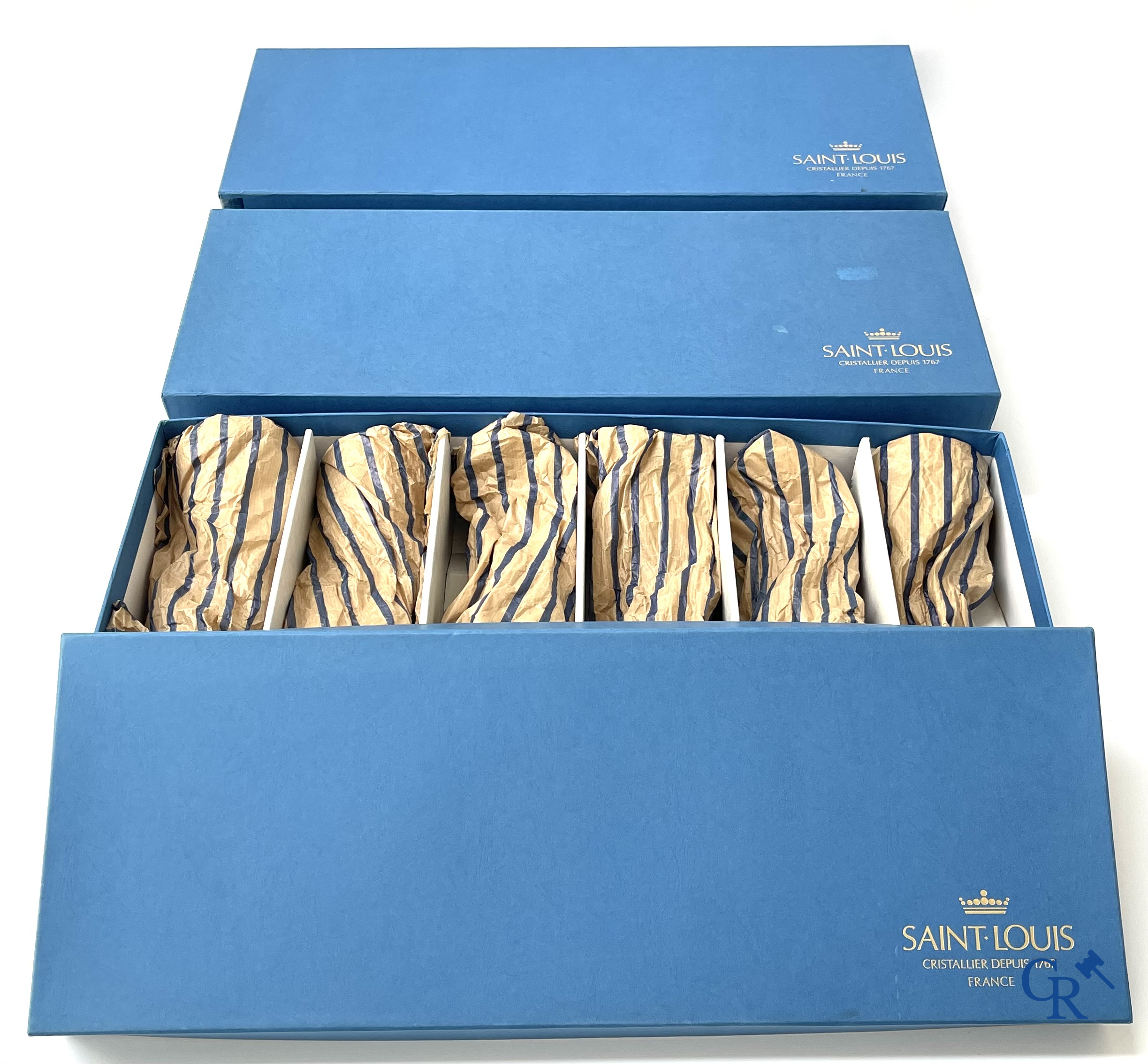 Cristal St. Louis France. A set of 18 coloured and cut glasses in crystal of Saint-Louis. In the original box.