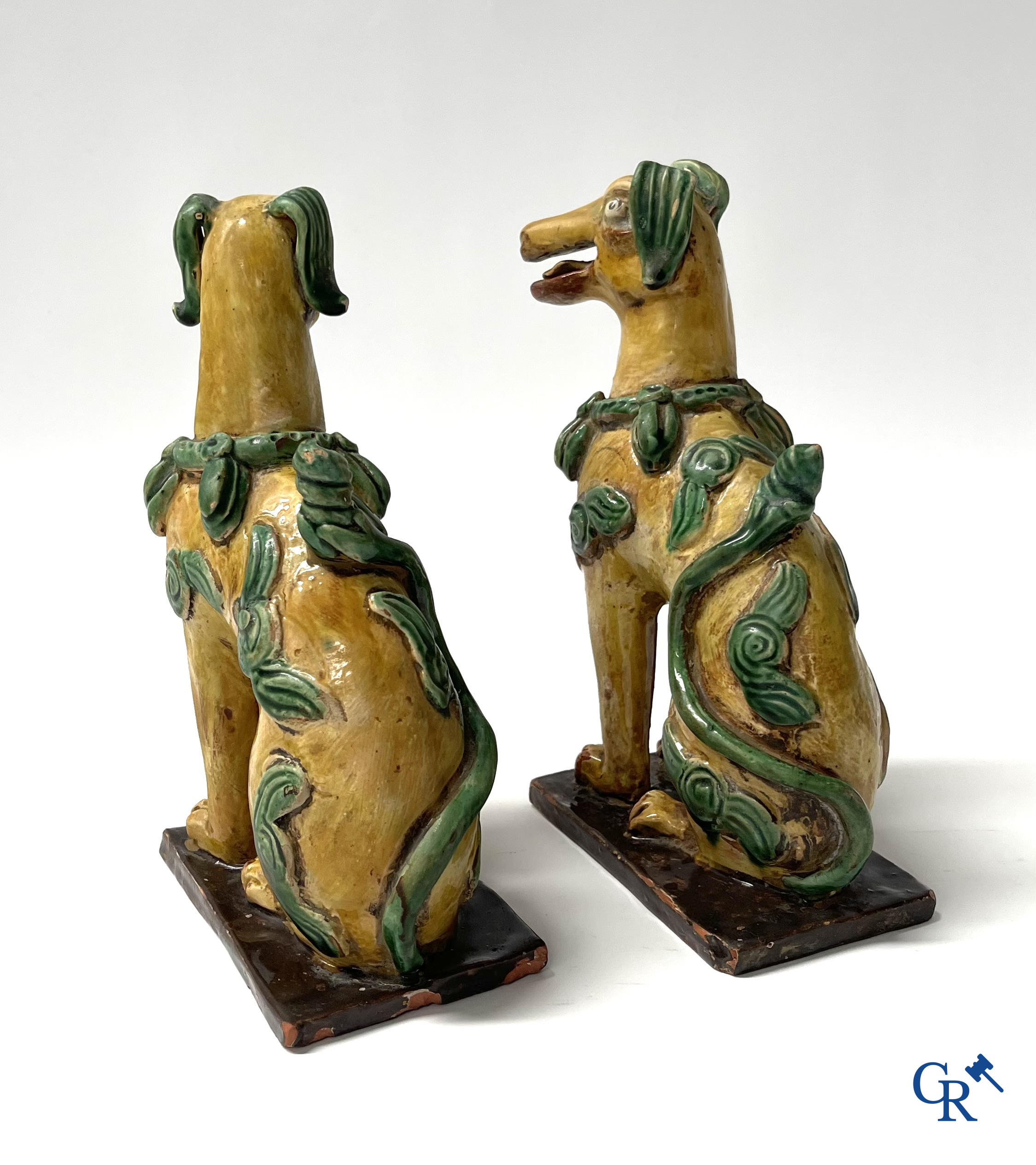 Asian Art, Chine. A pair of seated enamelled terra cotta dogs. 18th-19th century.