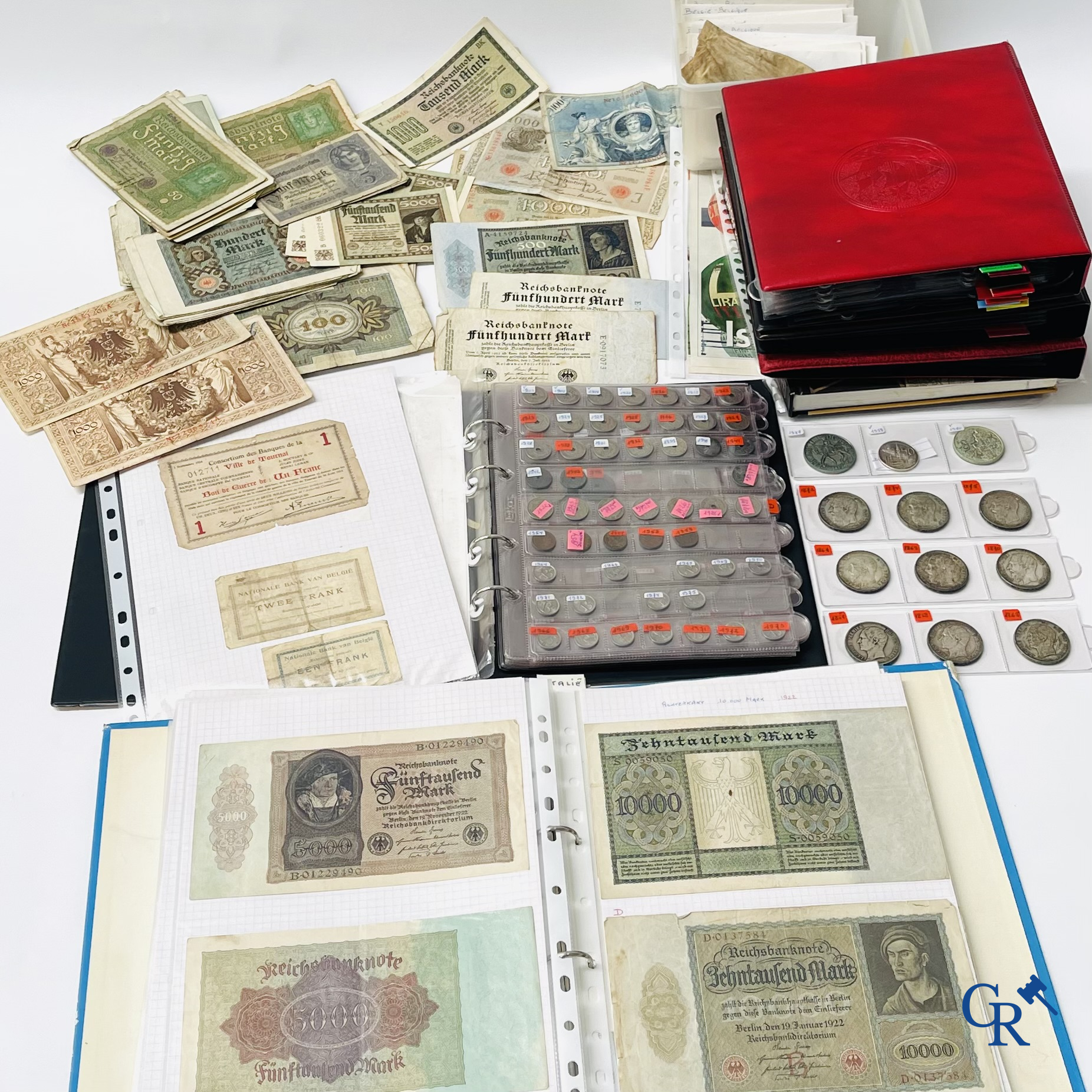Old coins and banknotes. A large collection of old coins and banknotes. Multiple coins in silver.