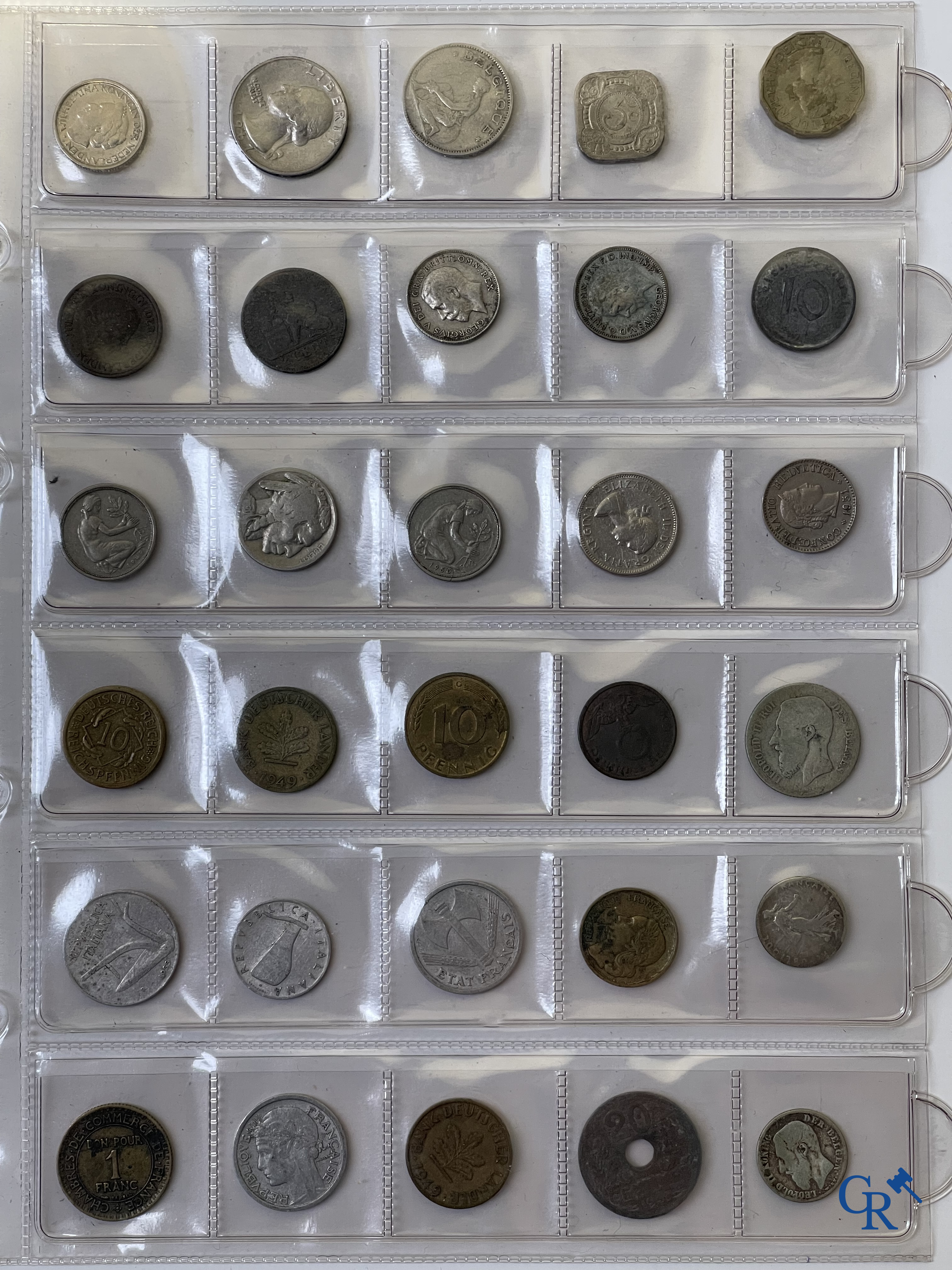 Coins. A folder of collectible coins including silver coins.