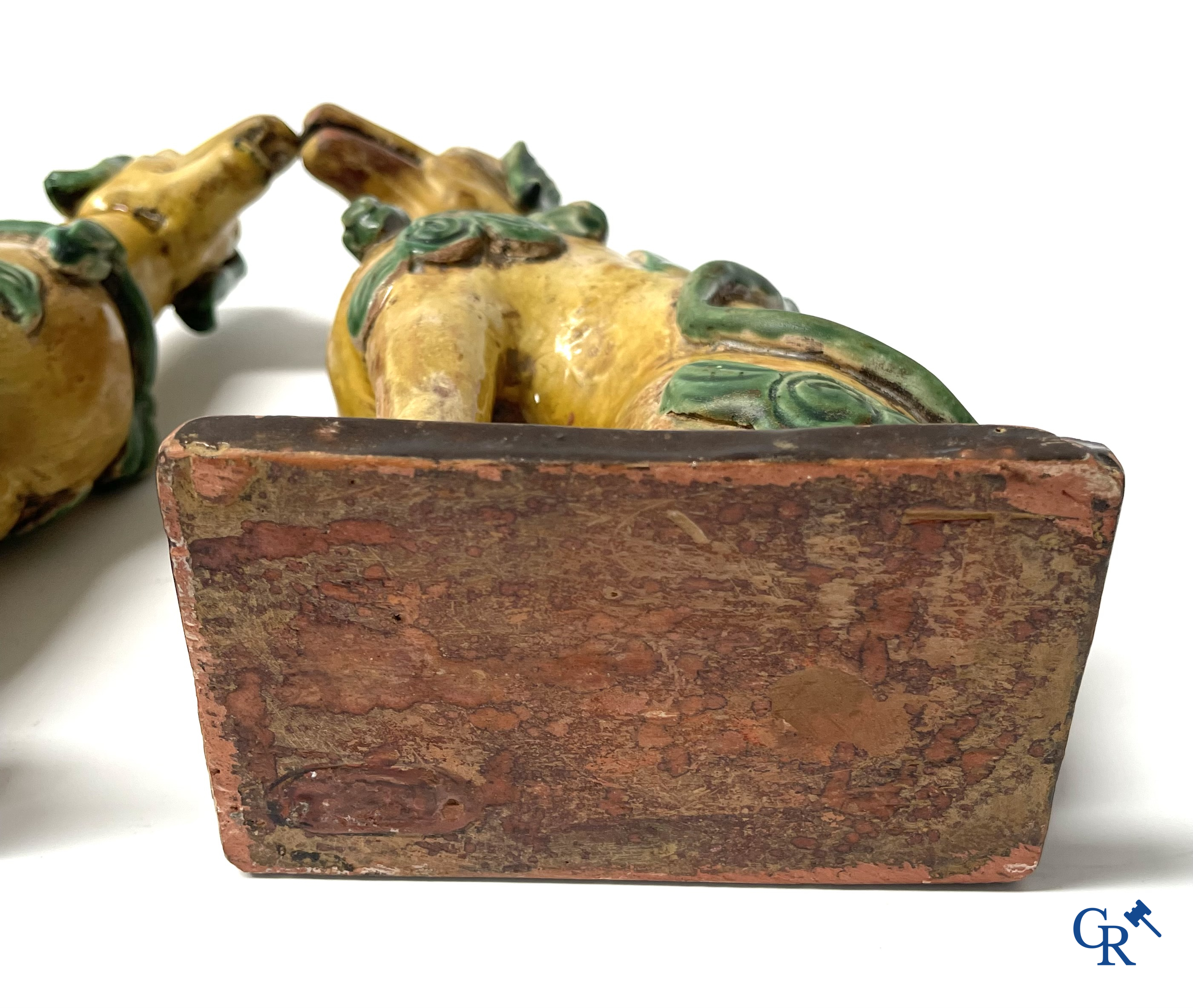 Asian Art, Chine. A pair of seated enamelled terra cotta dogs. 18th-19th century.