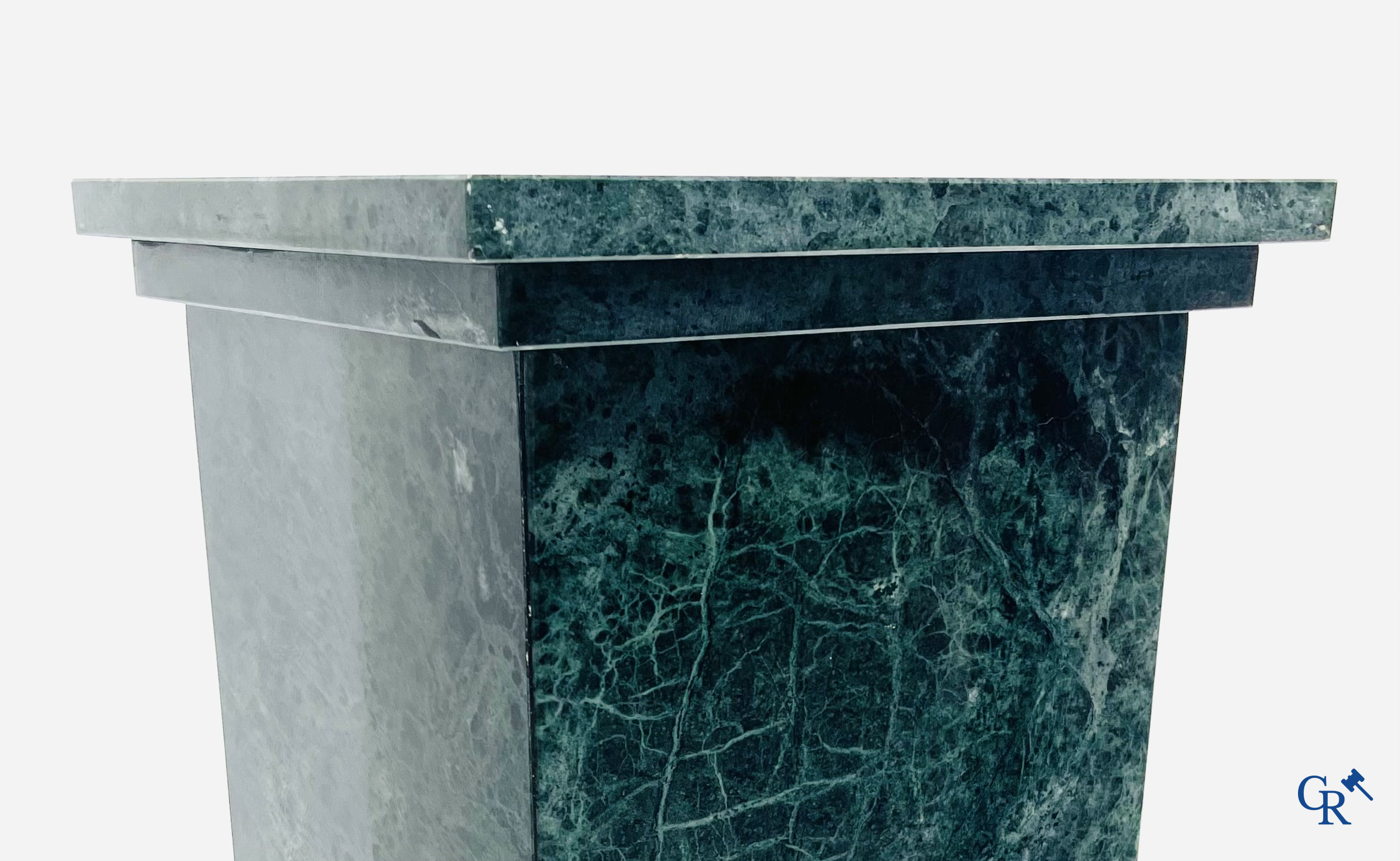 A large pedestal in green marble. 20th century.