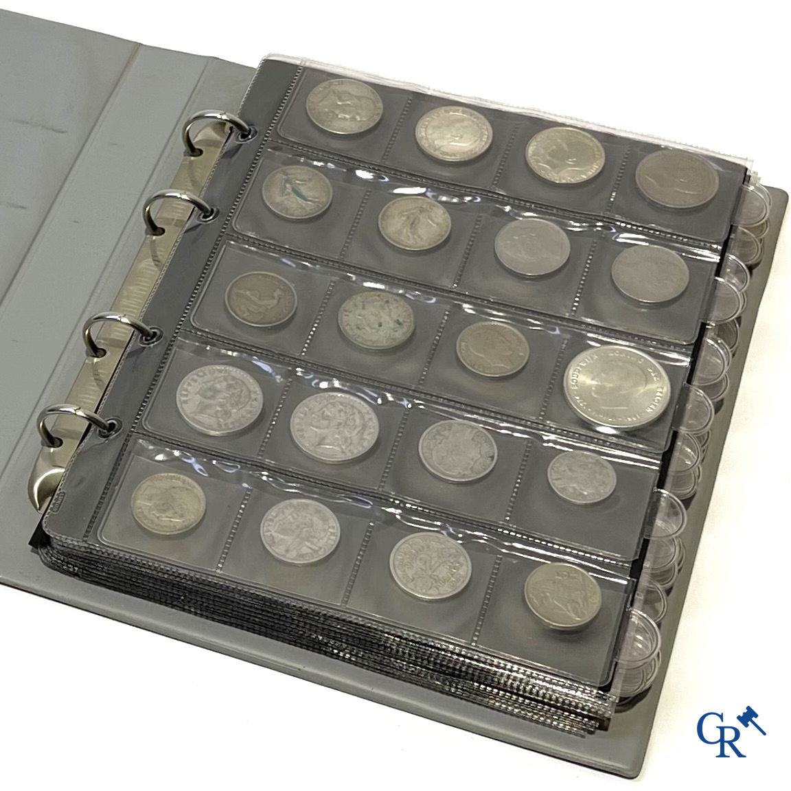 Coins. A folder of collectible coins including silver coins.