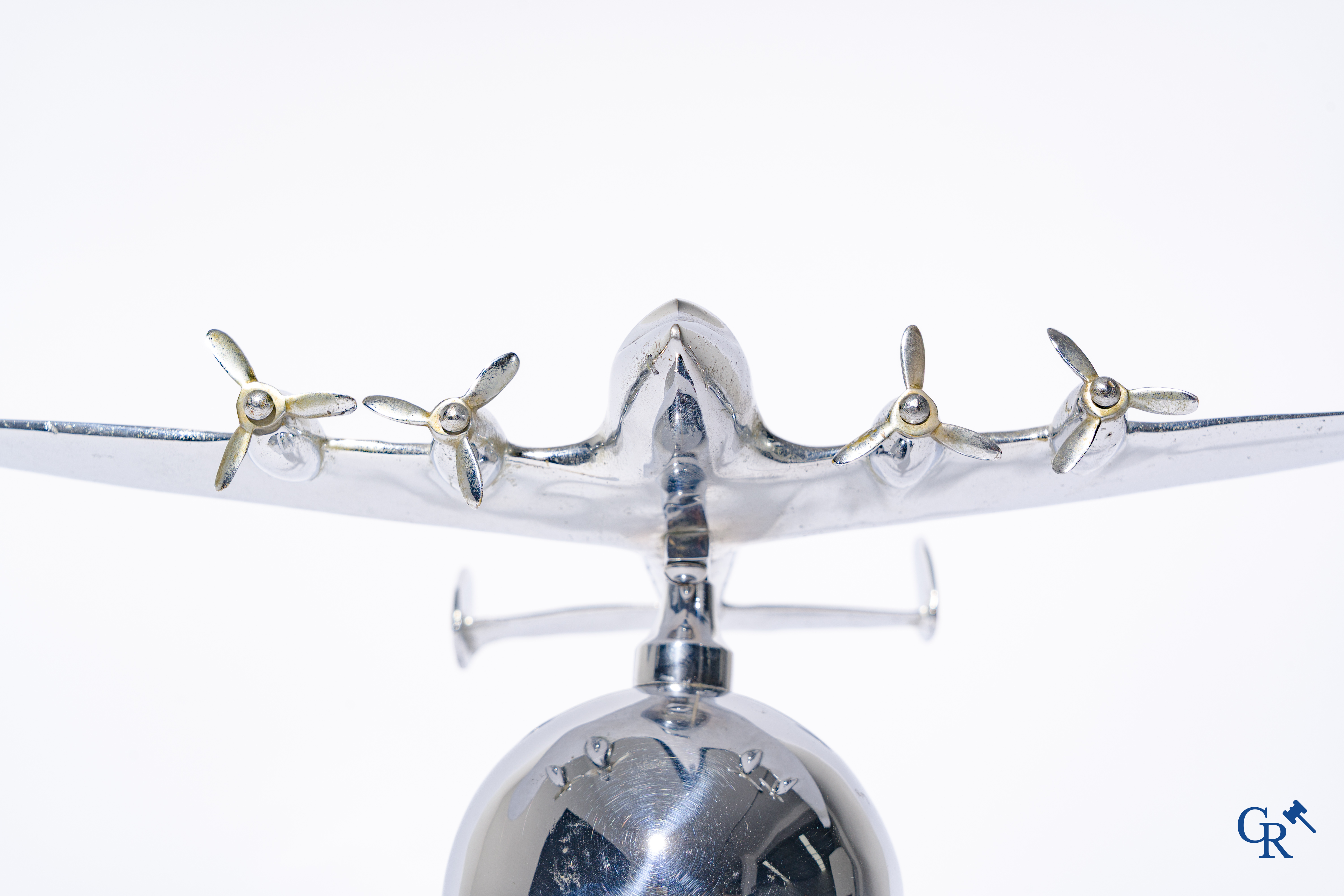 Art Deco, a 1930's desk model of an aircraft in chrome-plated bronze mounted on a stand.