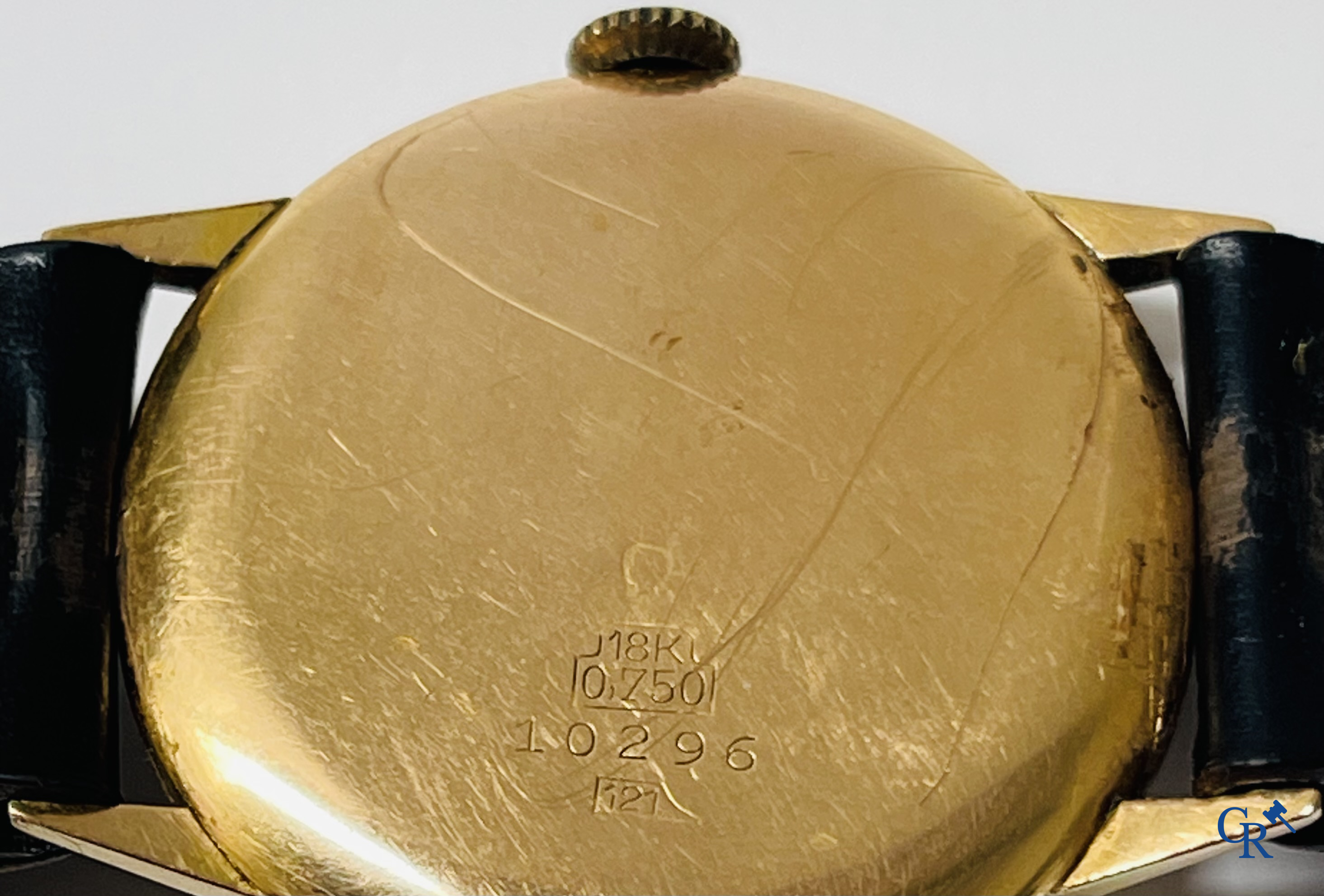 Uurwerken. Zwitsers werk. Een herenpolshorloge met gouden 750°/00 horlogekast.