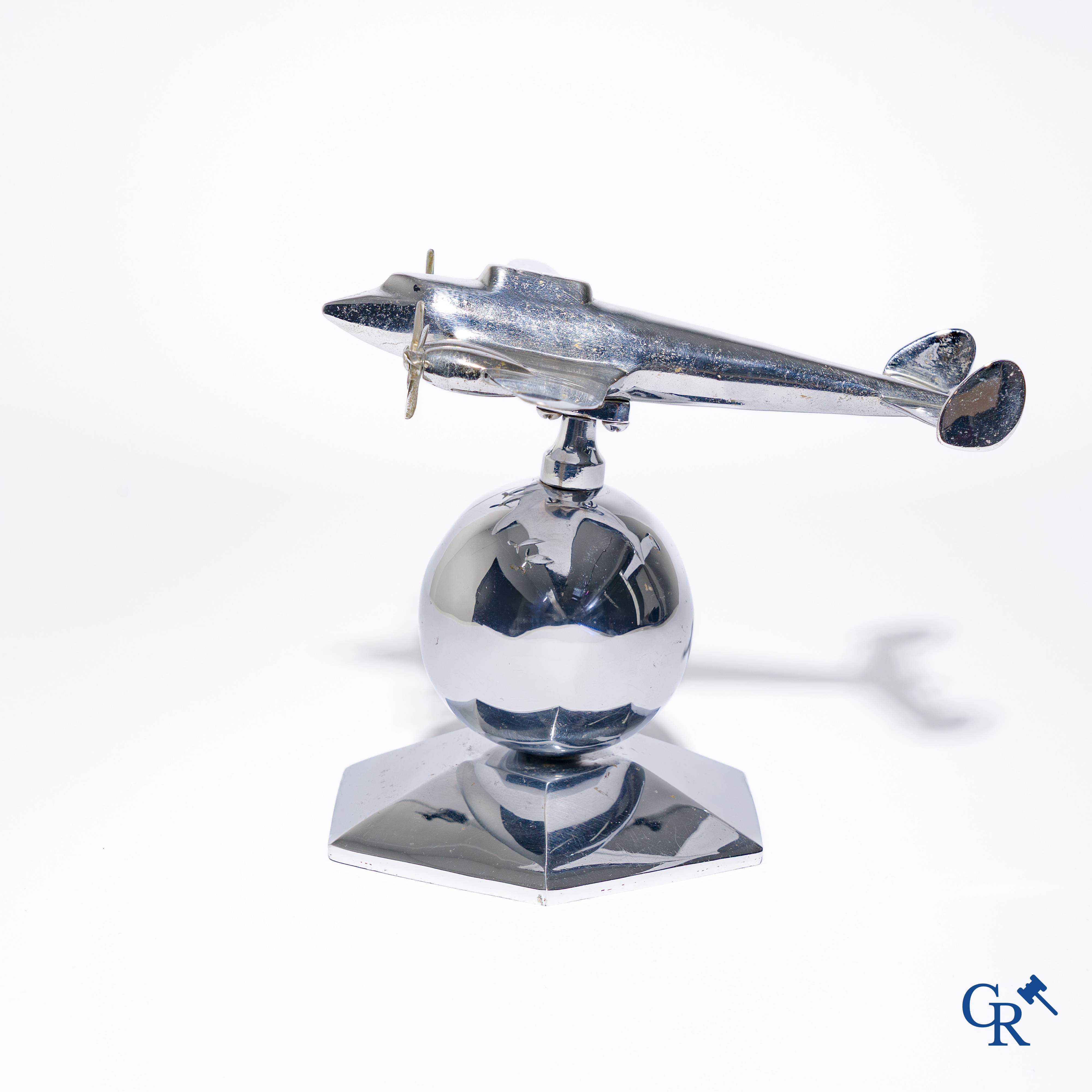 Art Deco, a 1930's desk model of an aircraft in chrome-plated bronze mounted on a stand.