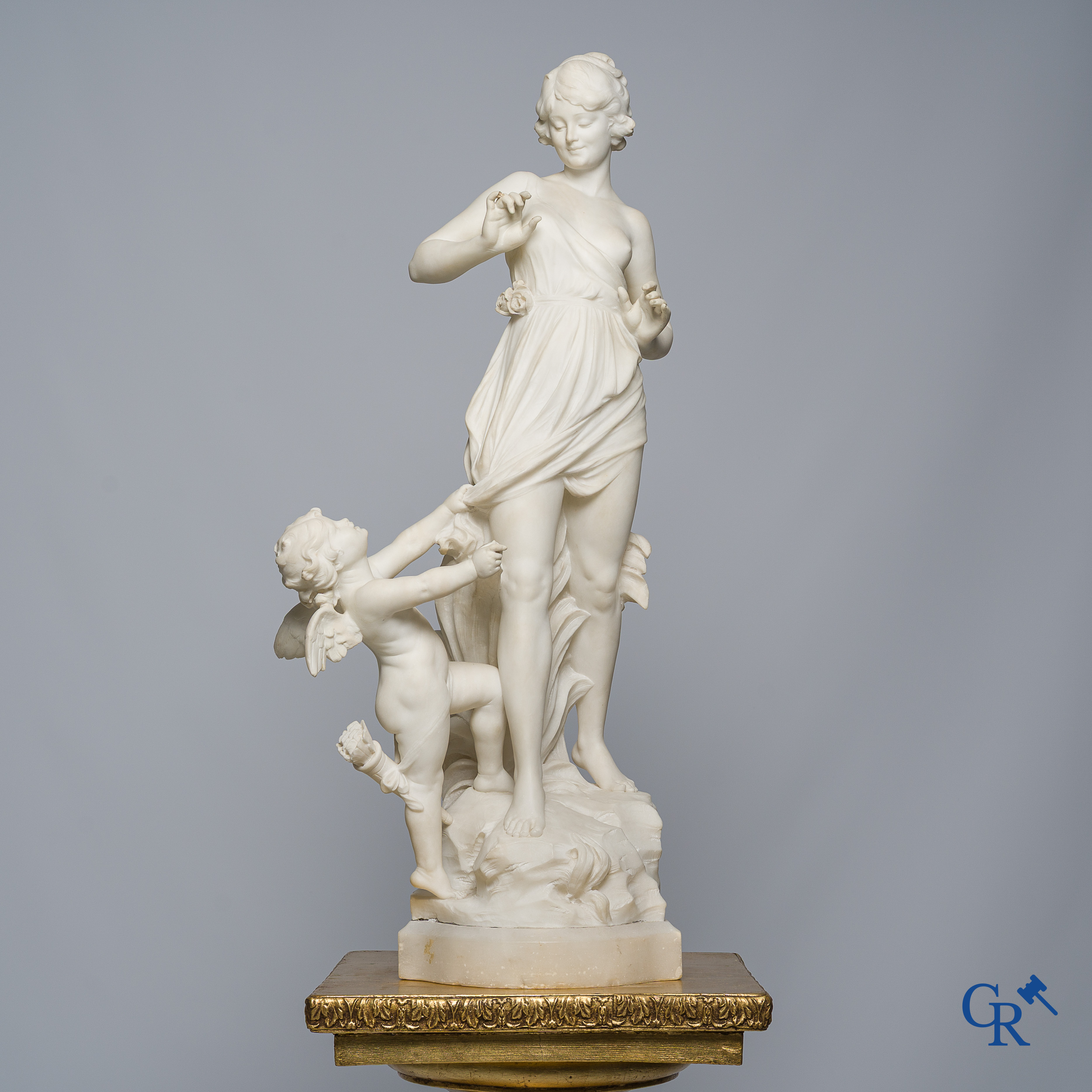 Cipriani. Romantic representation in sculpted marble. Young lady with cupid. LXVI style pedestal. Circa 1900.