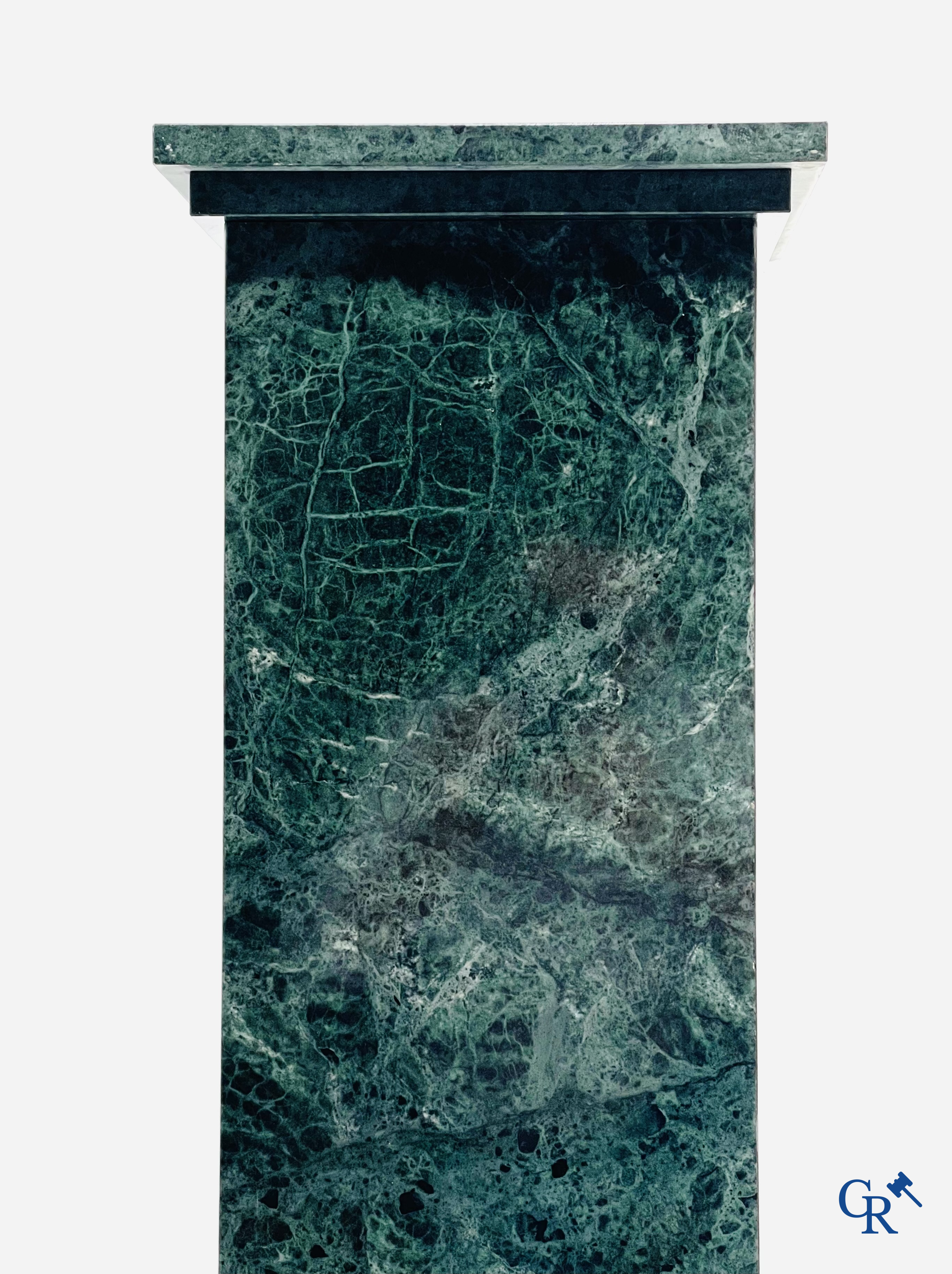 A large pedestal in green marble. 20th century.