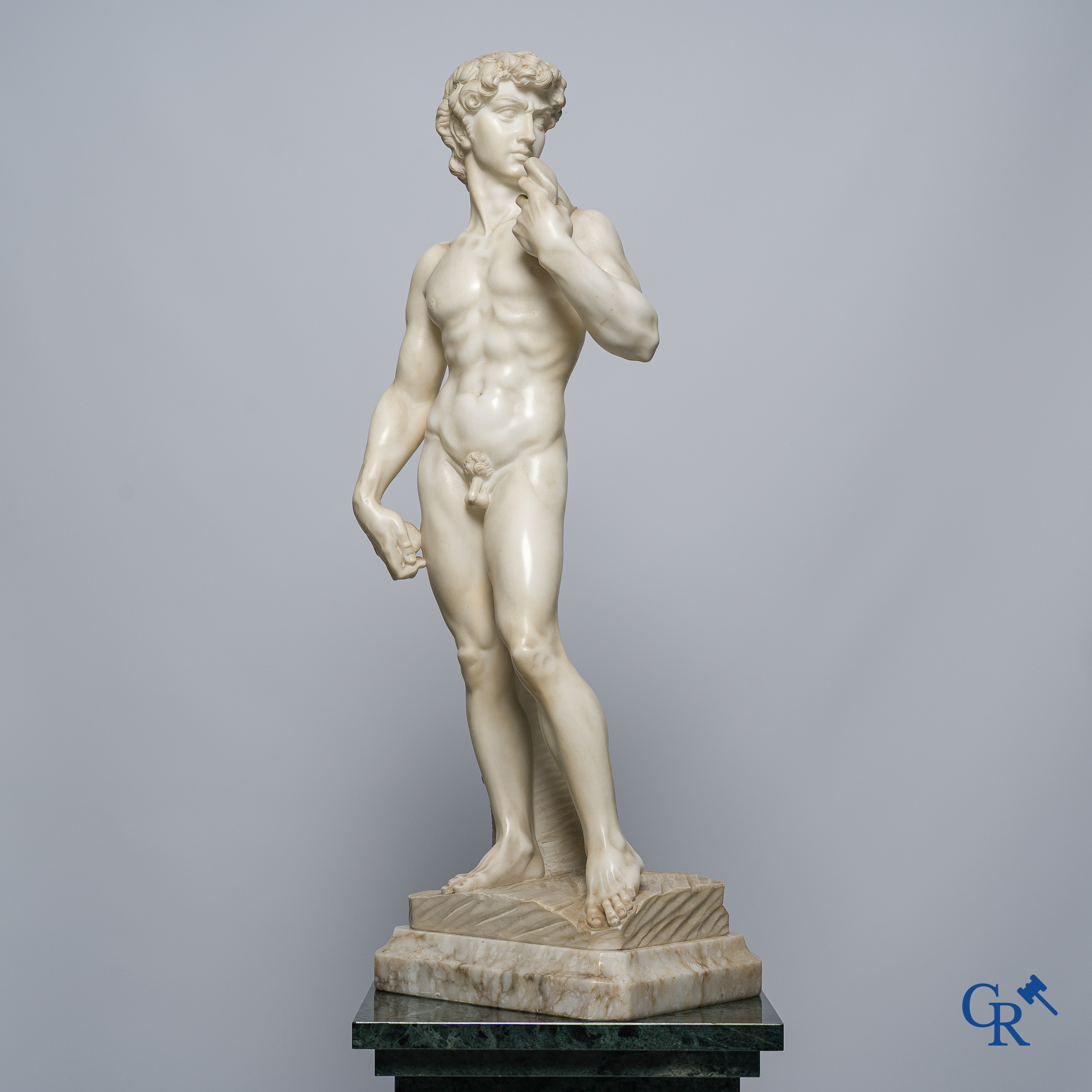 Michelangelo (after) In the antique style. Representation of David in sculpted marble. Mid-20th century.