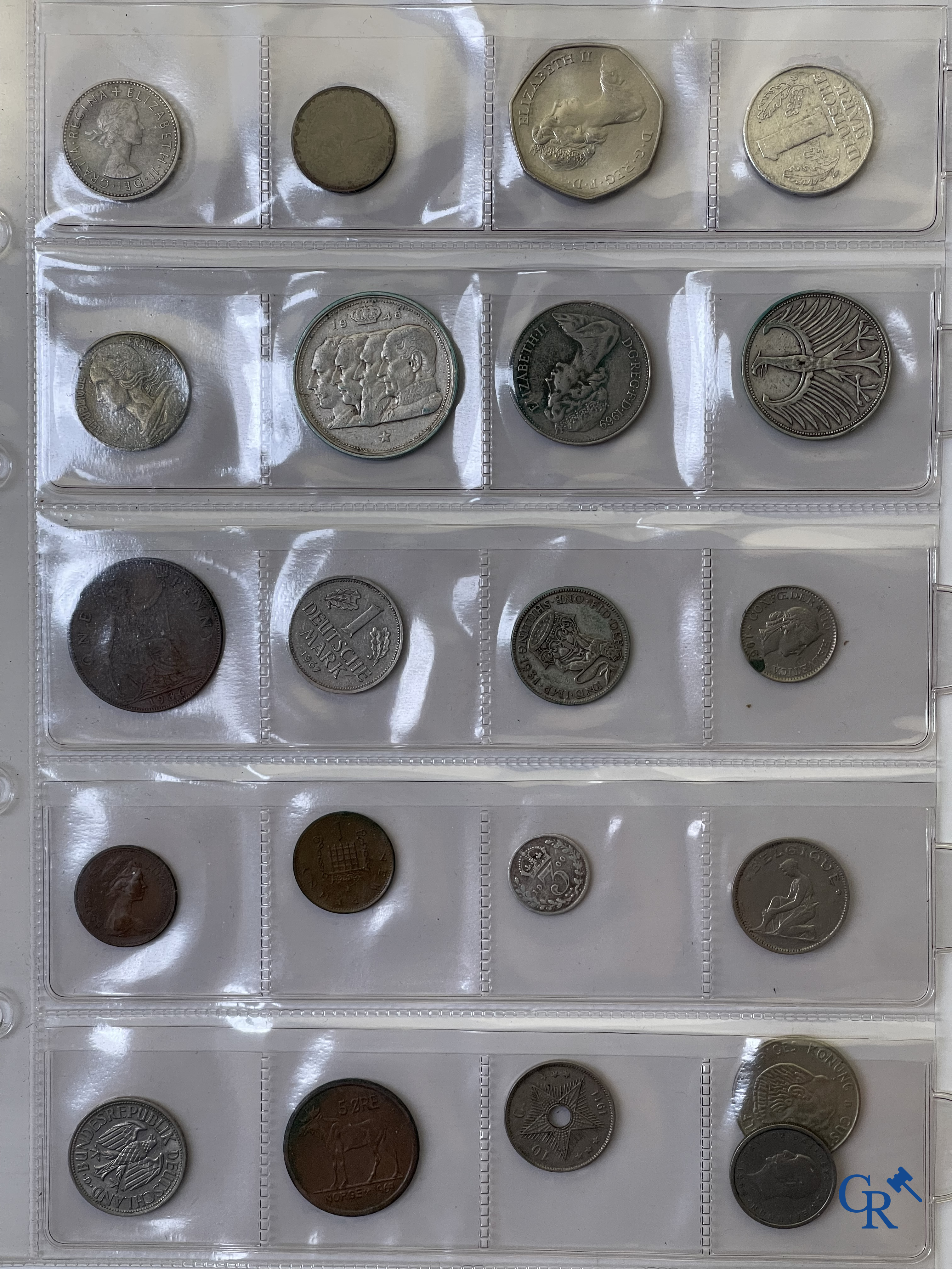 Coins. A folder of collectible coins including silver coins.