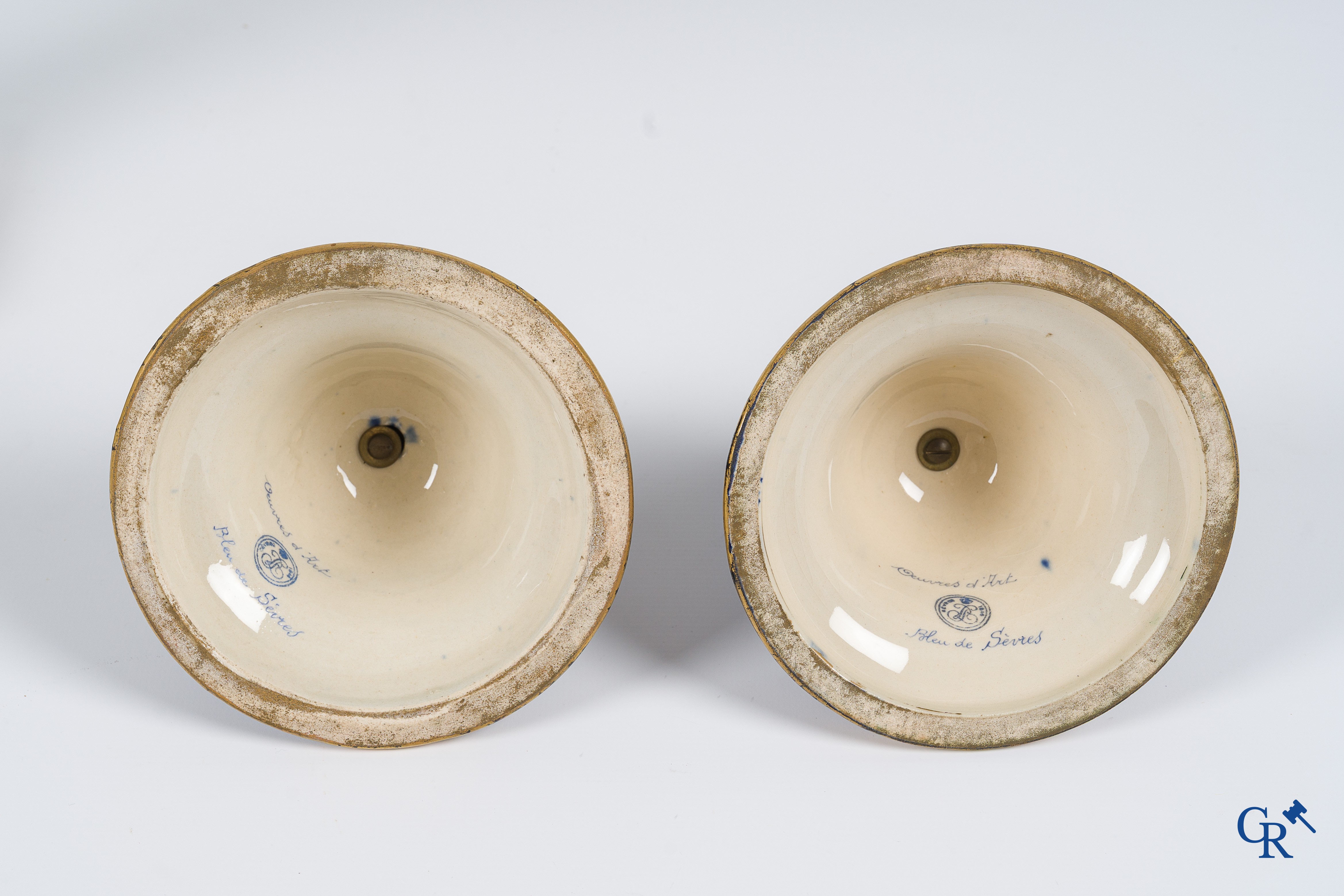 Sèvres. Pair of large decorated cobalt blue vases with bronze fittings and raised gilding. LXVI style. circa 1920.
