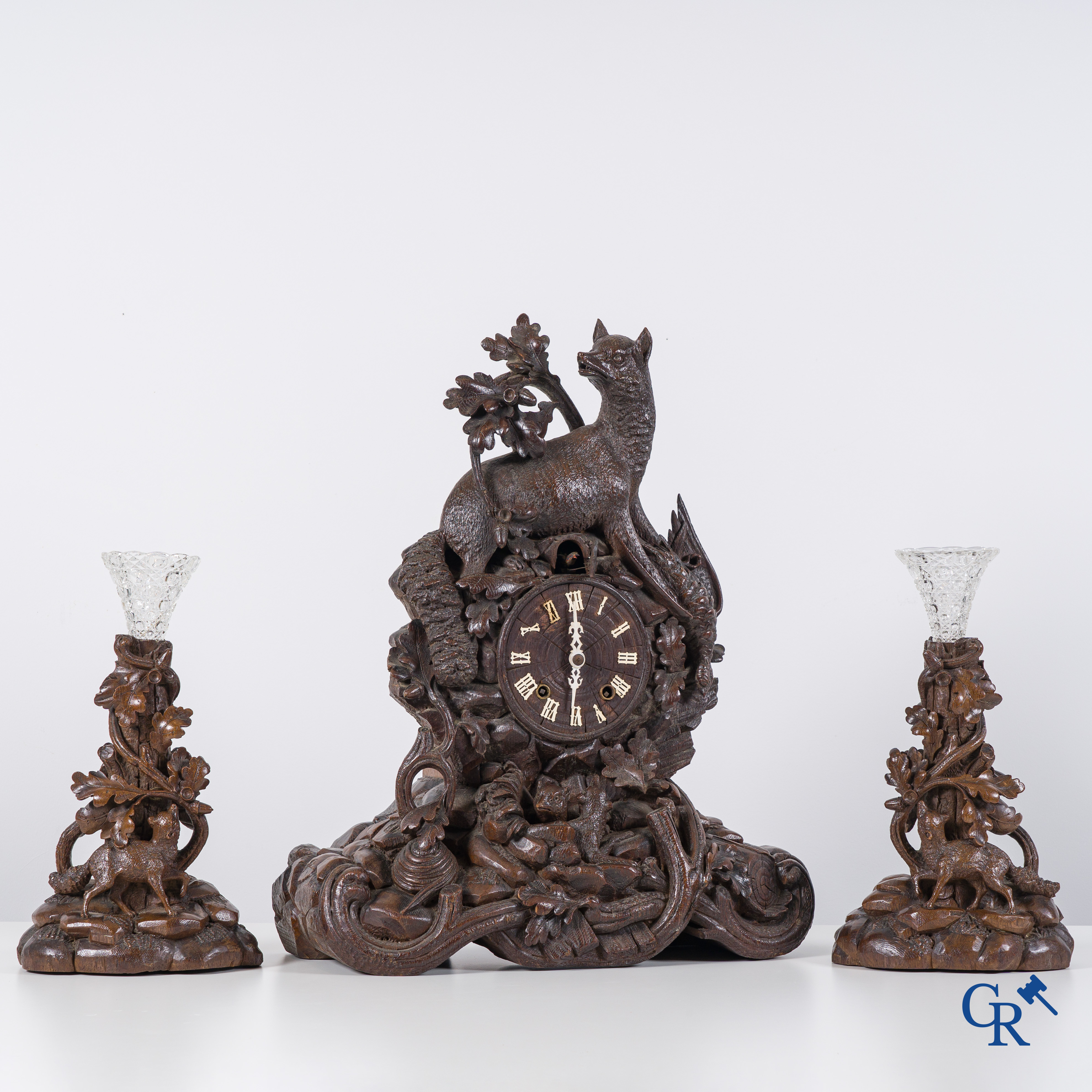 Black Forest, circa 1900. A large 3-piece cuckoo clock in sculpted wood.