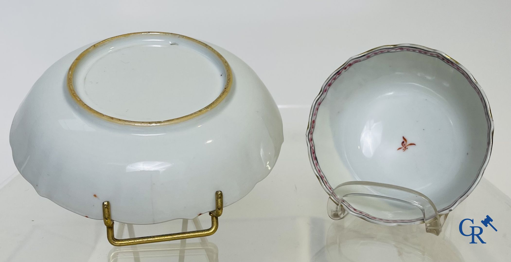 A large Chinese famille rose mandarin bowl, a famille rose cup and saucer and a figurine in blanc de chine.