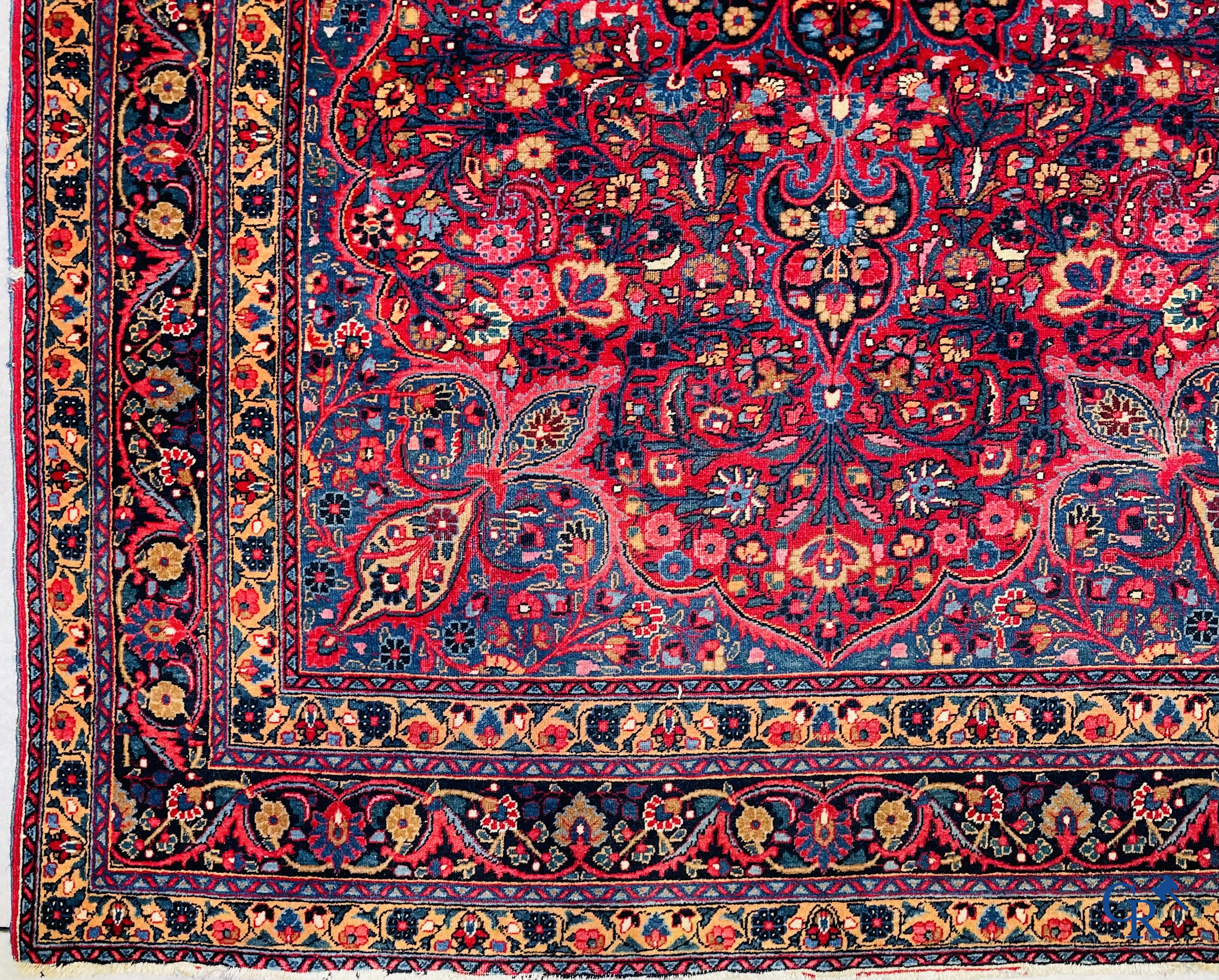 Oriental carpets: Iran, antique Persian carpet with dark red background.