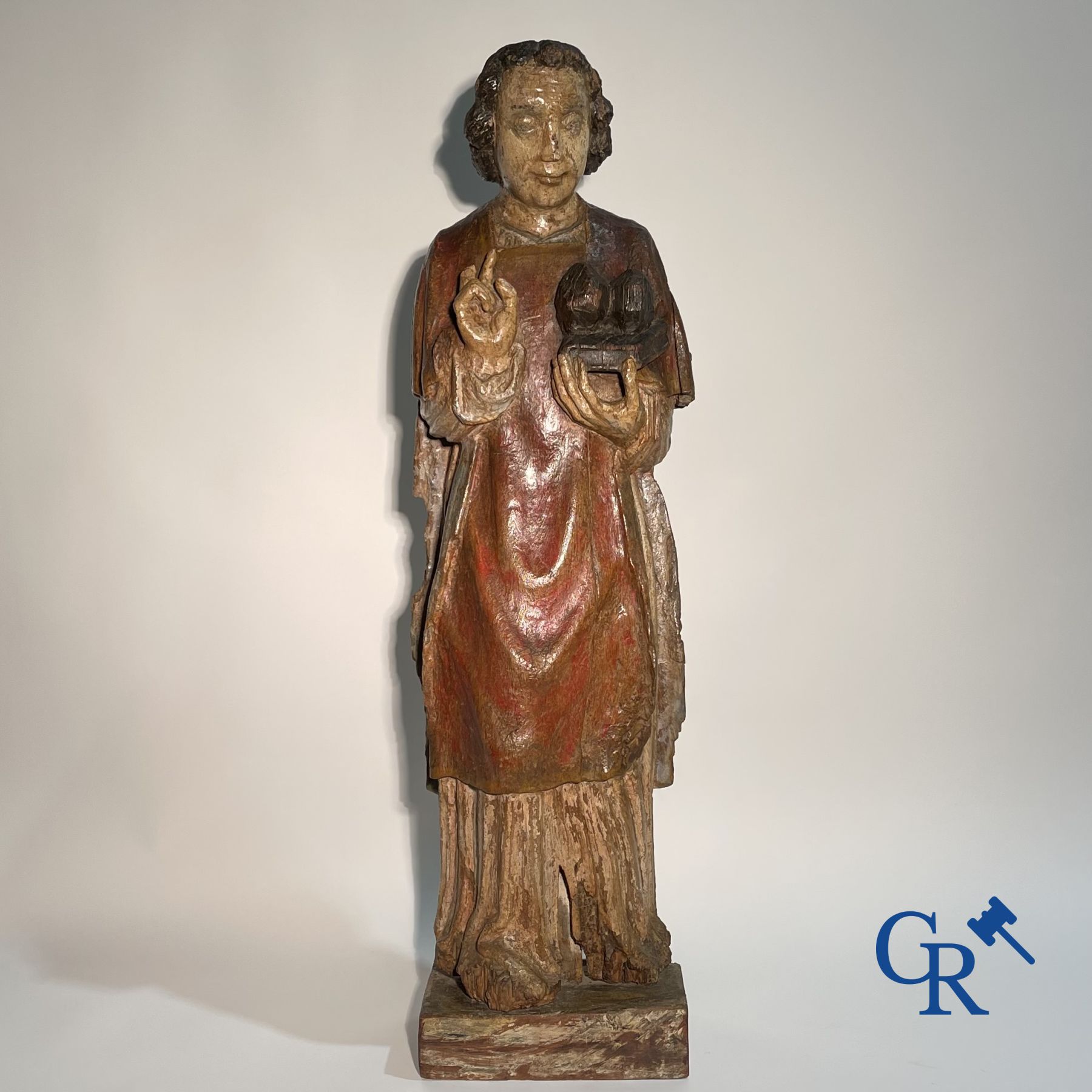 Wooden sculpture: Polychrome wood sculpture of a saint. Saint Stephen. Probably 17th century.