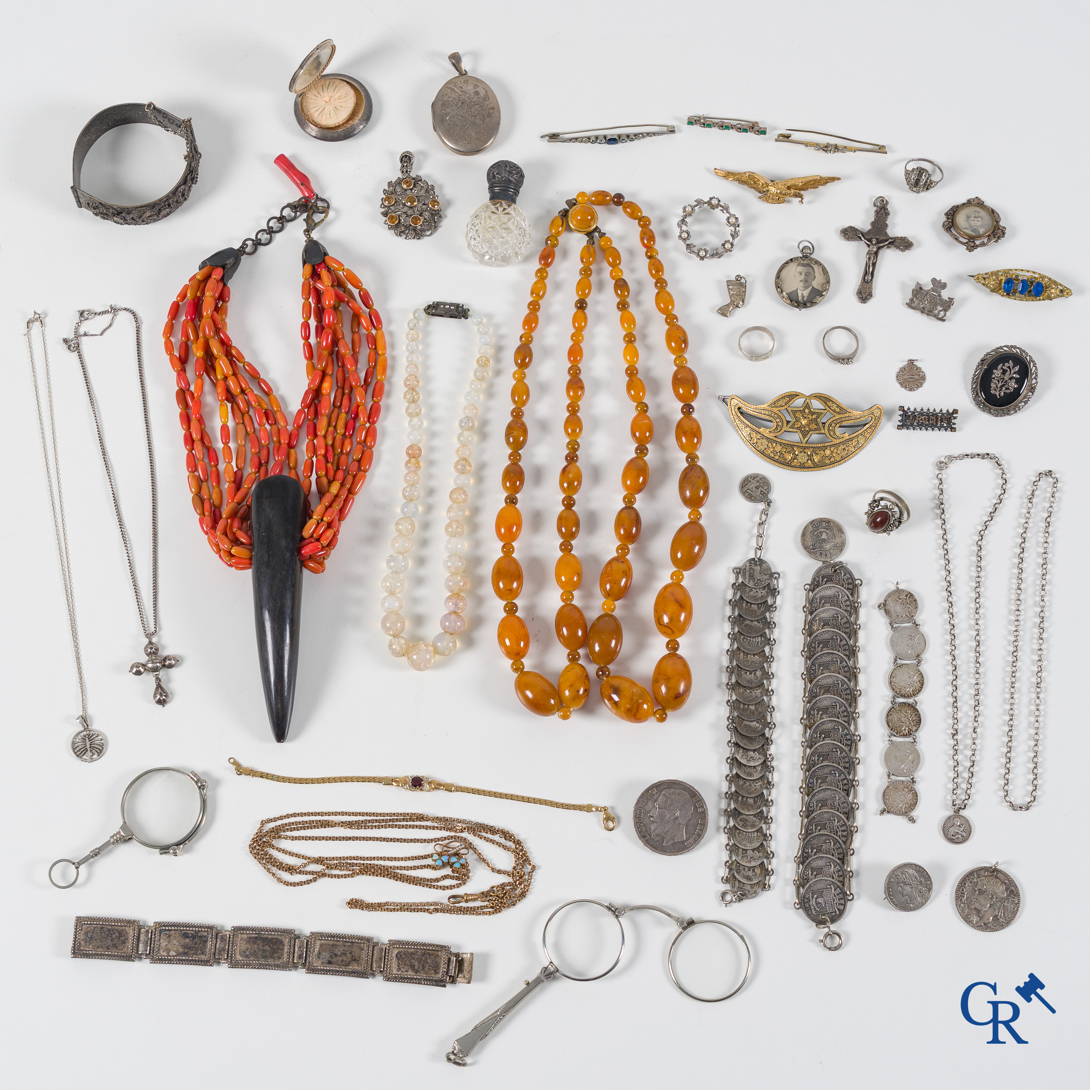 A large lot of fantasy jewellery, some in silver. We Attached a necklace in coral and an amber-like rock.