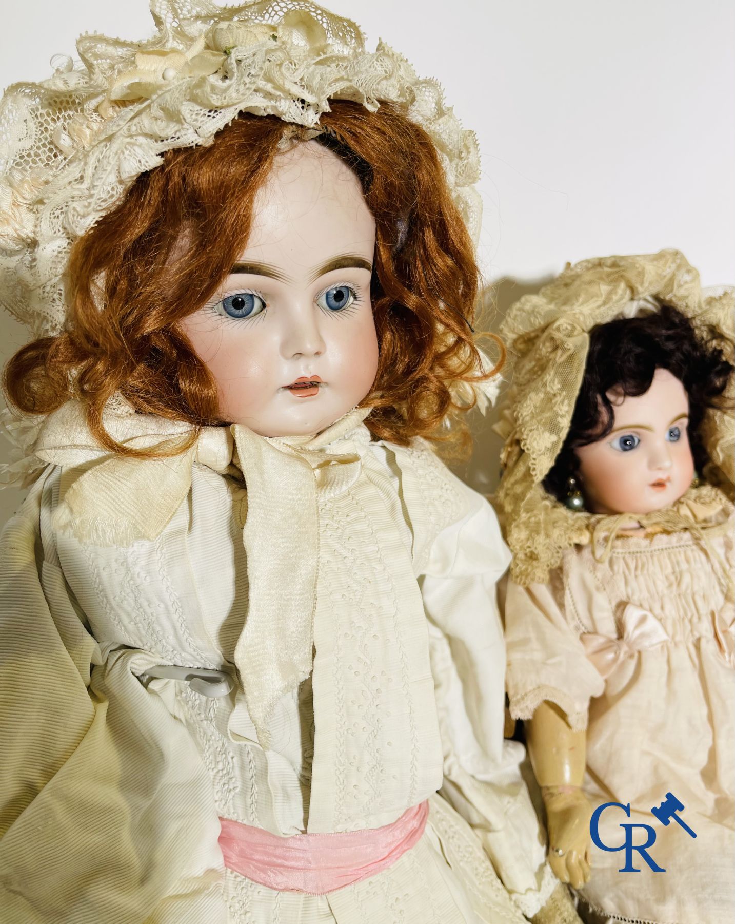 Toys: antique dolls. 3 dolls with porcelain head and a dog in fur.