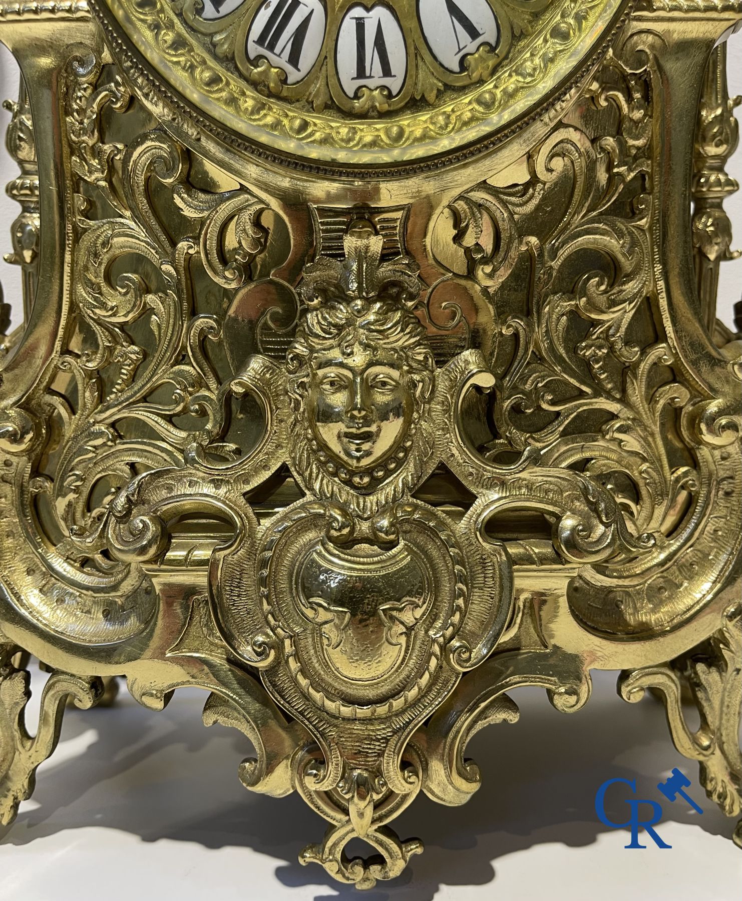 A three-part bronze fireplace clockset in Renaissance style and 2 painted tin and bronze pendant clocks.