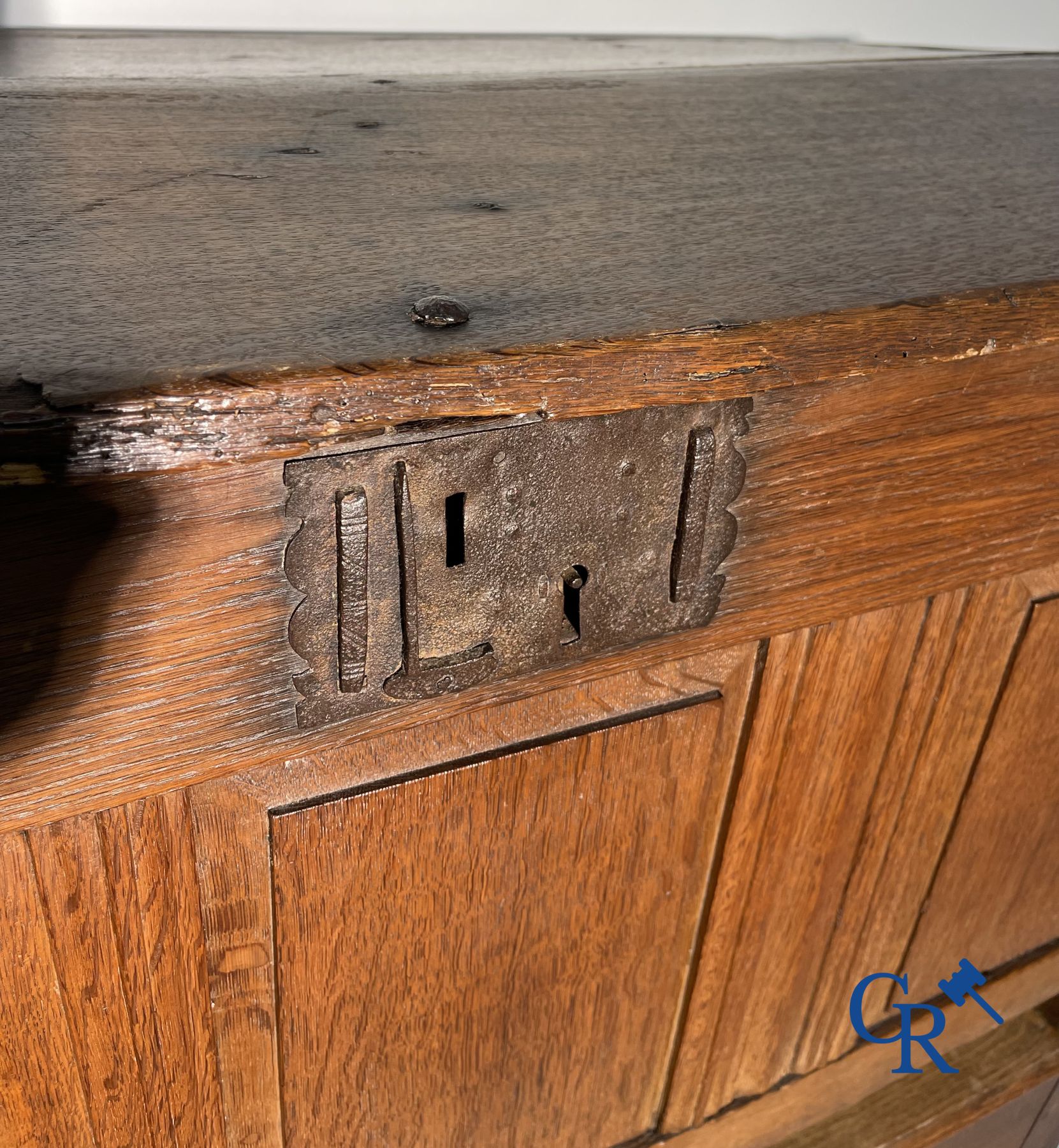 2 oak chests and an antique cast iron fireplace plate.