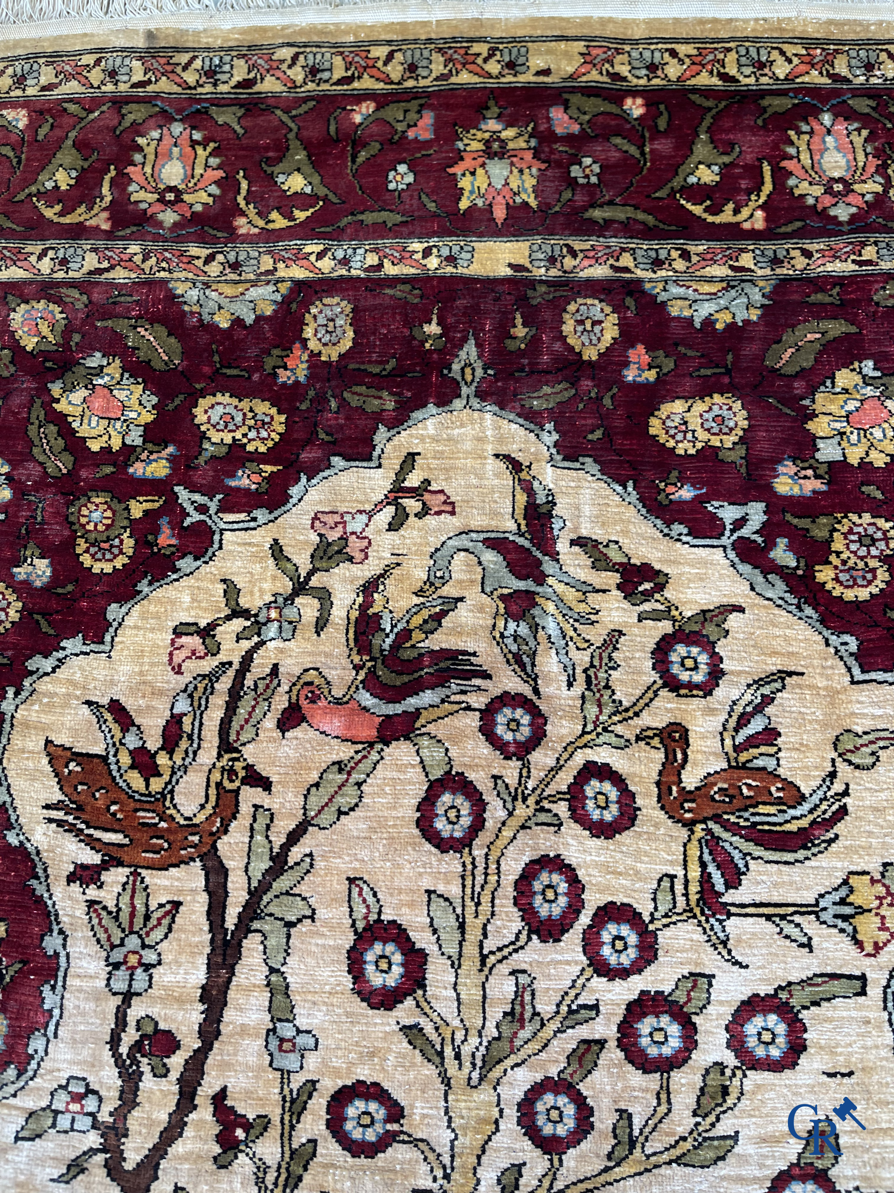 Oriental carpets, Hereke, a finely hand-knotted and signed silk carpet with a tree of life.