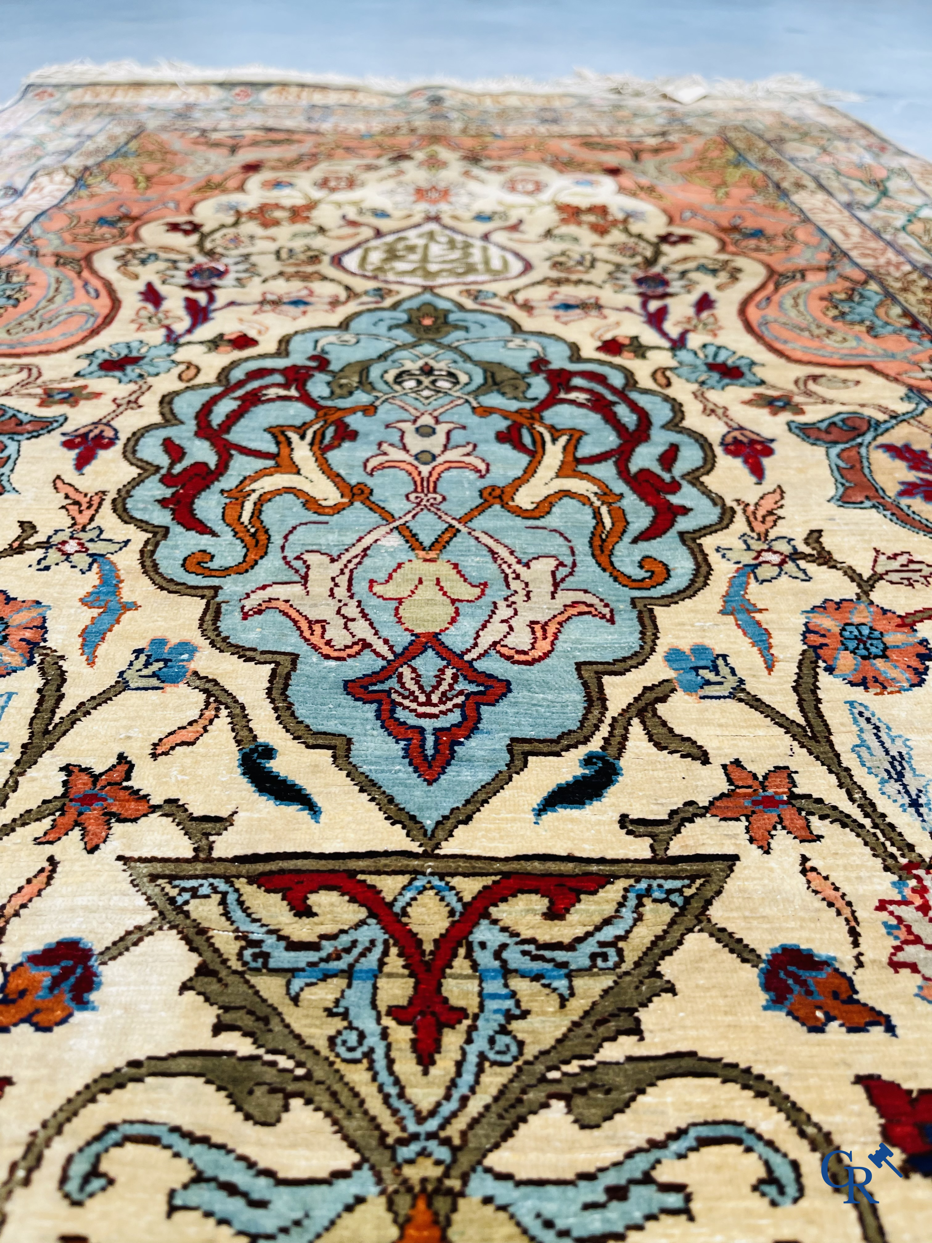 Oriental carpets, Hereke Turkey, a finely hand-knotted silk carpet with inscriptions and gold thread.