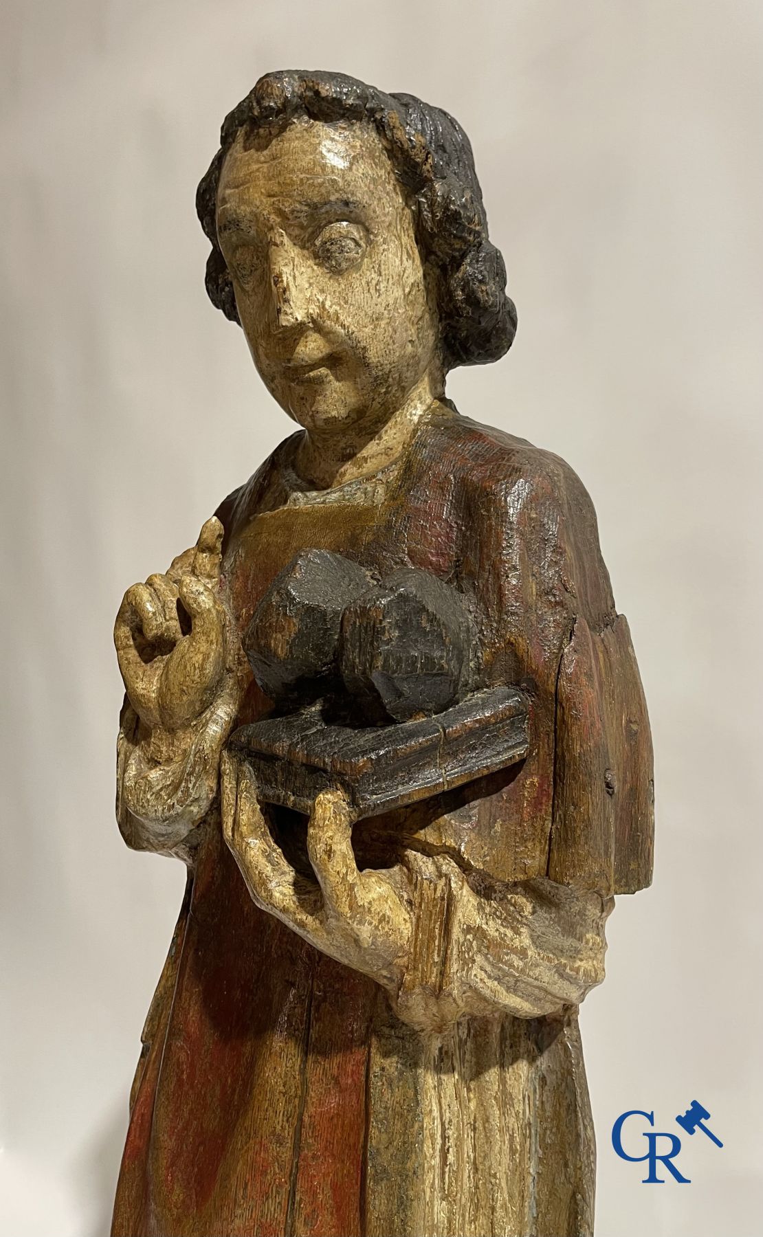 Wooden sculpture: Polychrome wood sculpture of a saint. Saint Stephen. Probably 17th century.