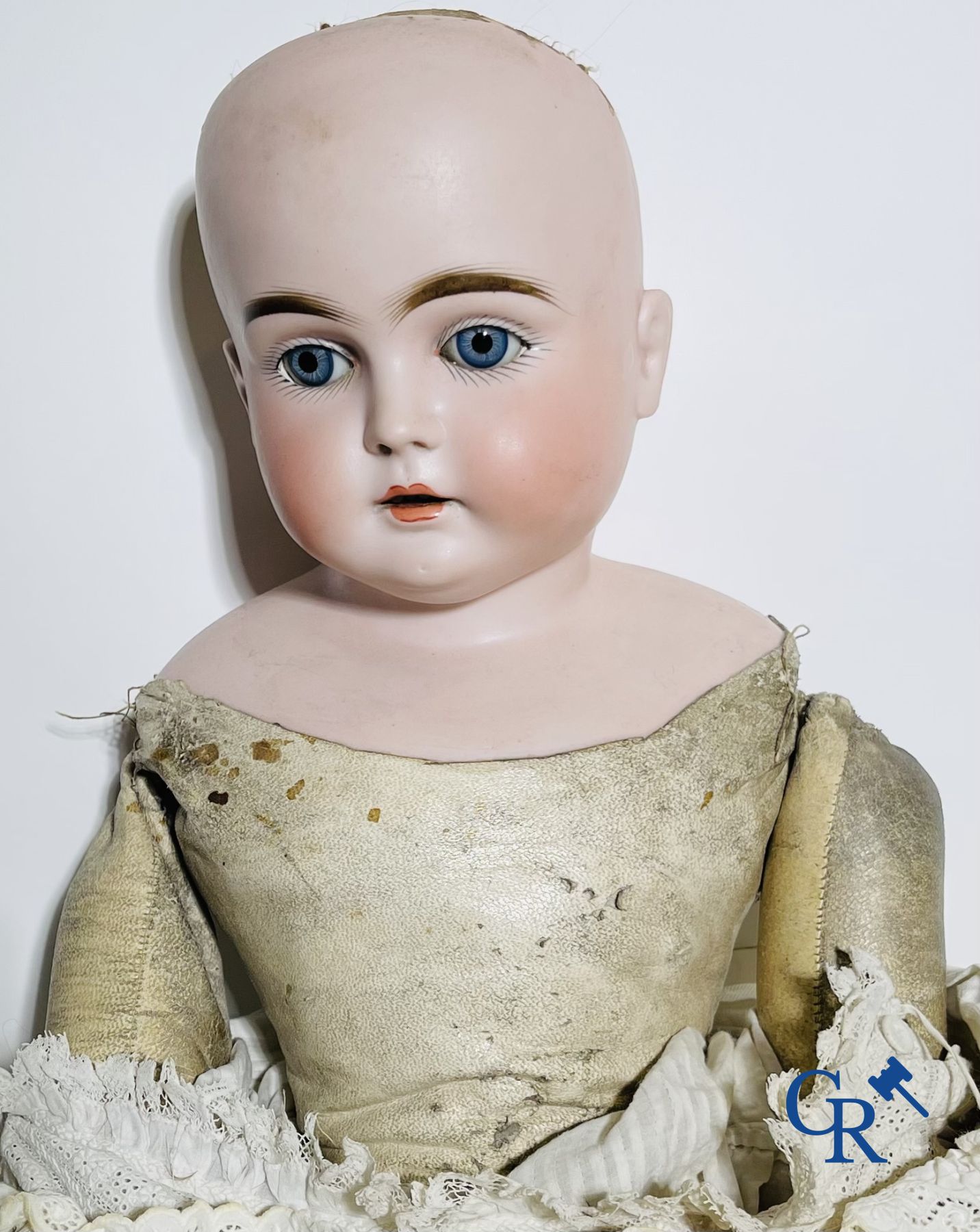 Toys: antique dolls. 3 dolls with porcelain head and a dog in fur.