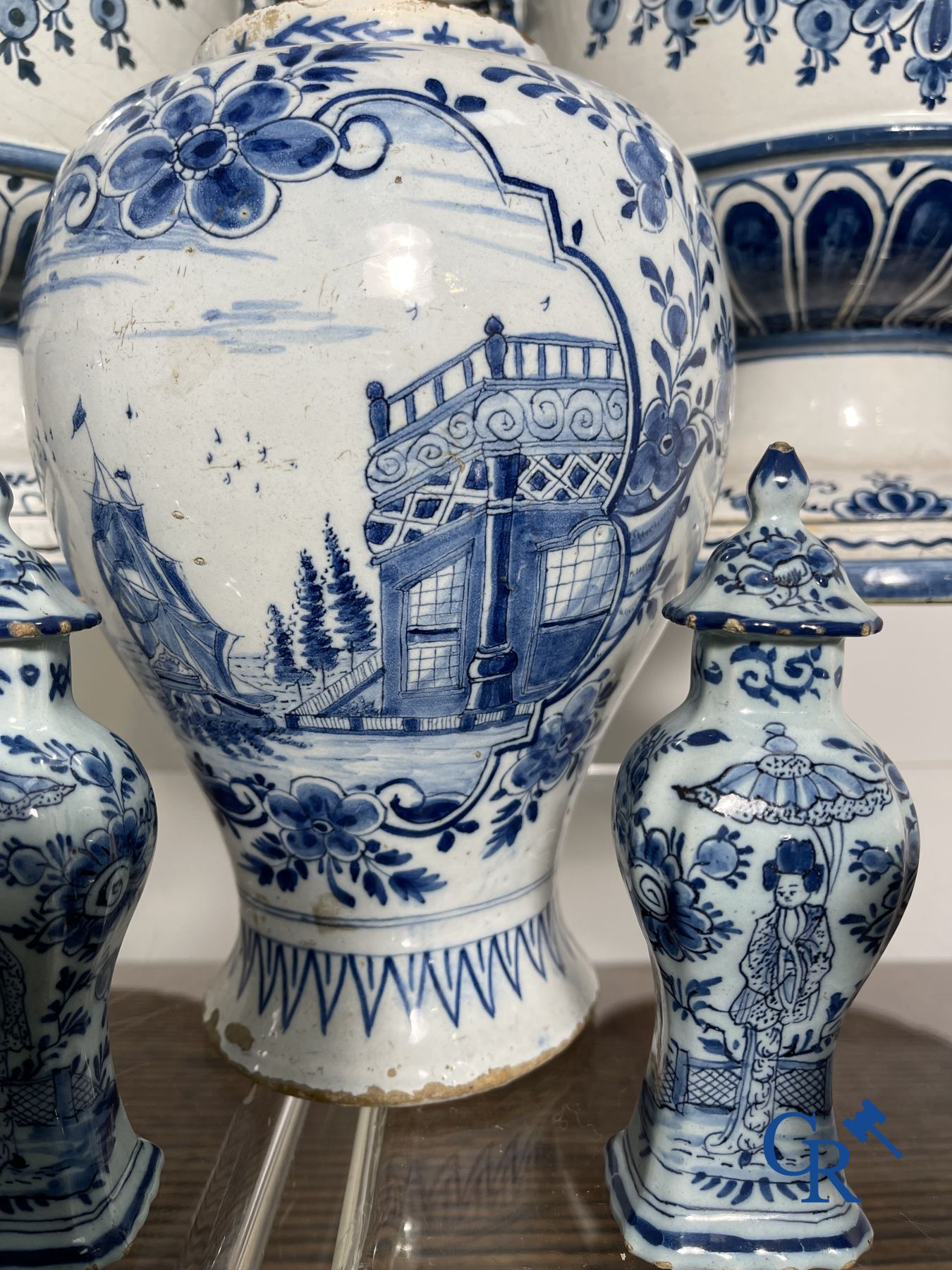 Delft: 11 pieces of blue and white faience with different décors. 17th - 18th century.