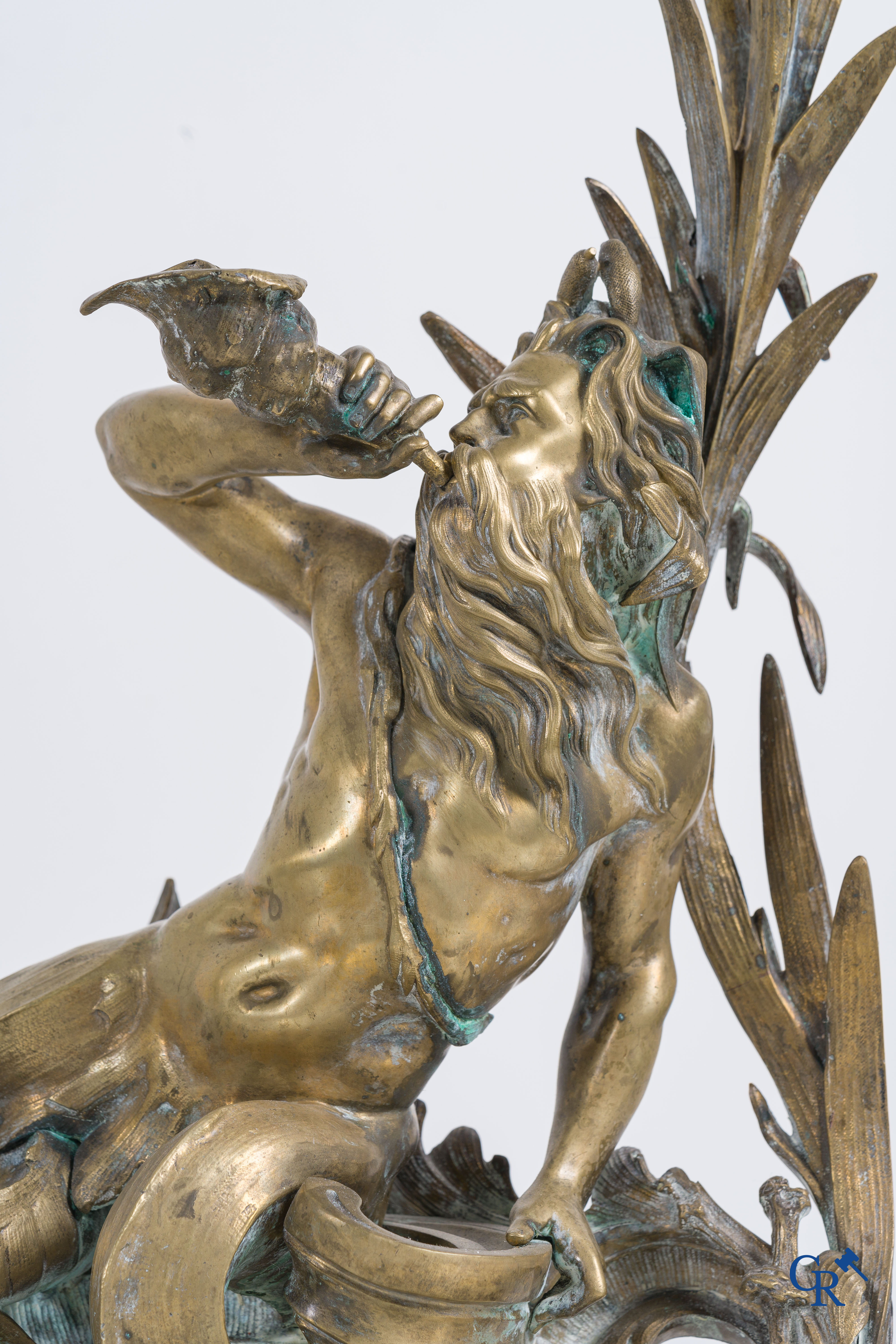 A large pair of finely chiseled bronze chenets with Tritons. Louis XV style. Napoleon III period.