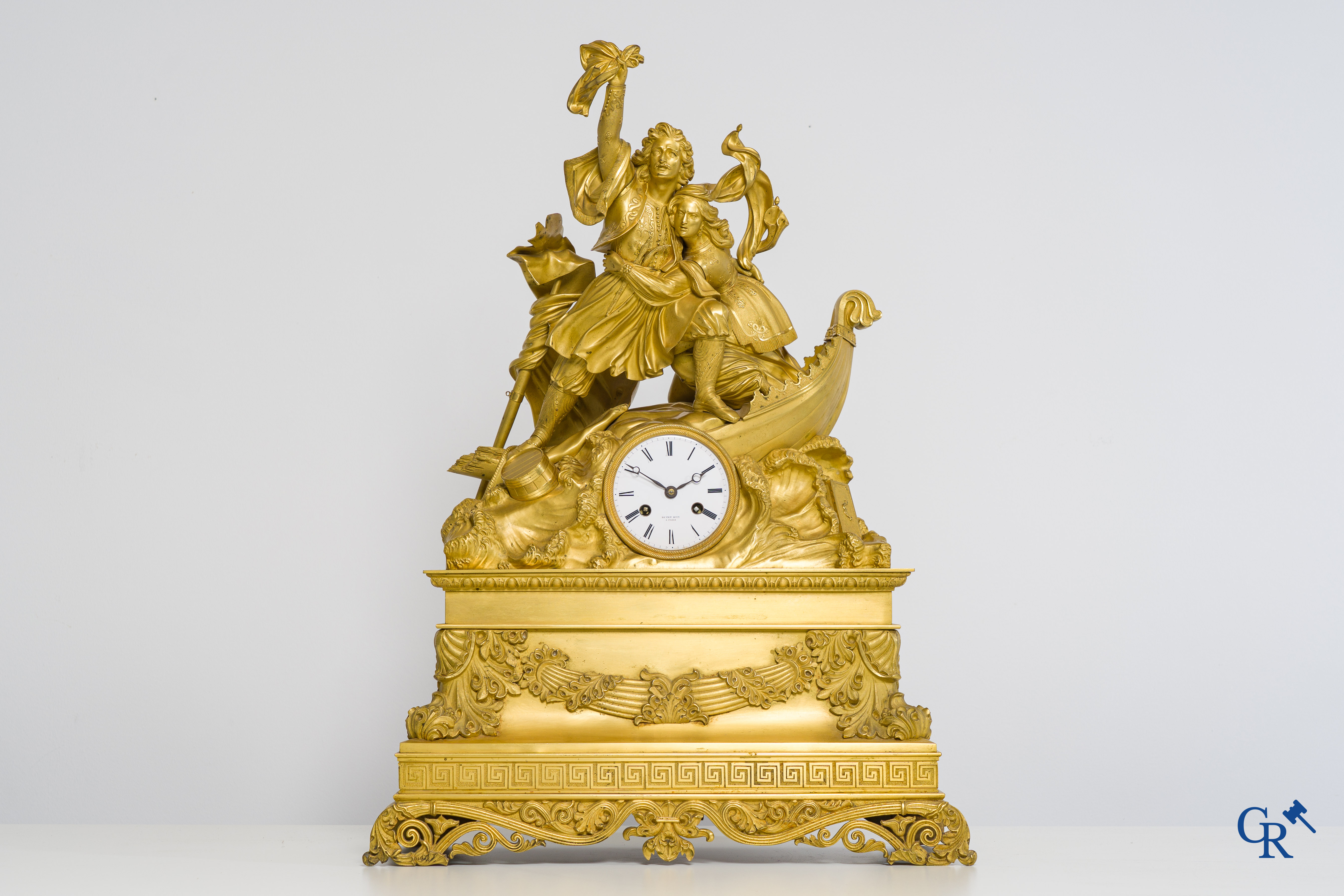 Butet horlogier à Paris. Gilded bronze chimney clock with enamelled dial. Charles X period.