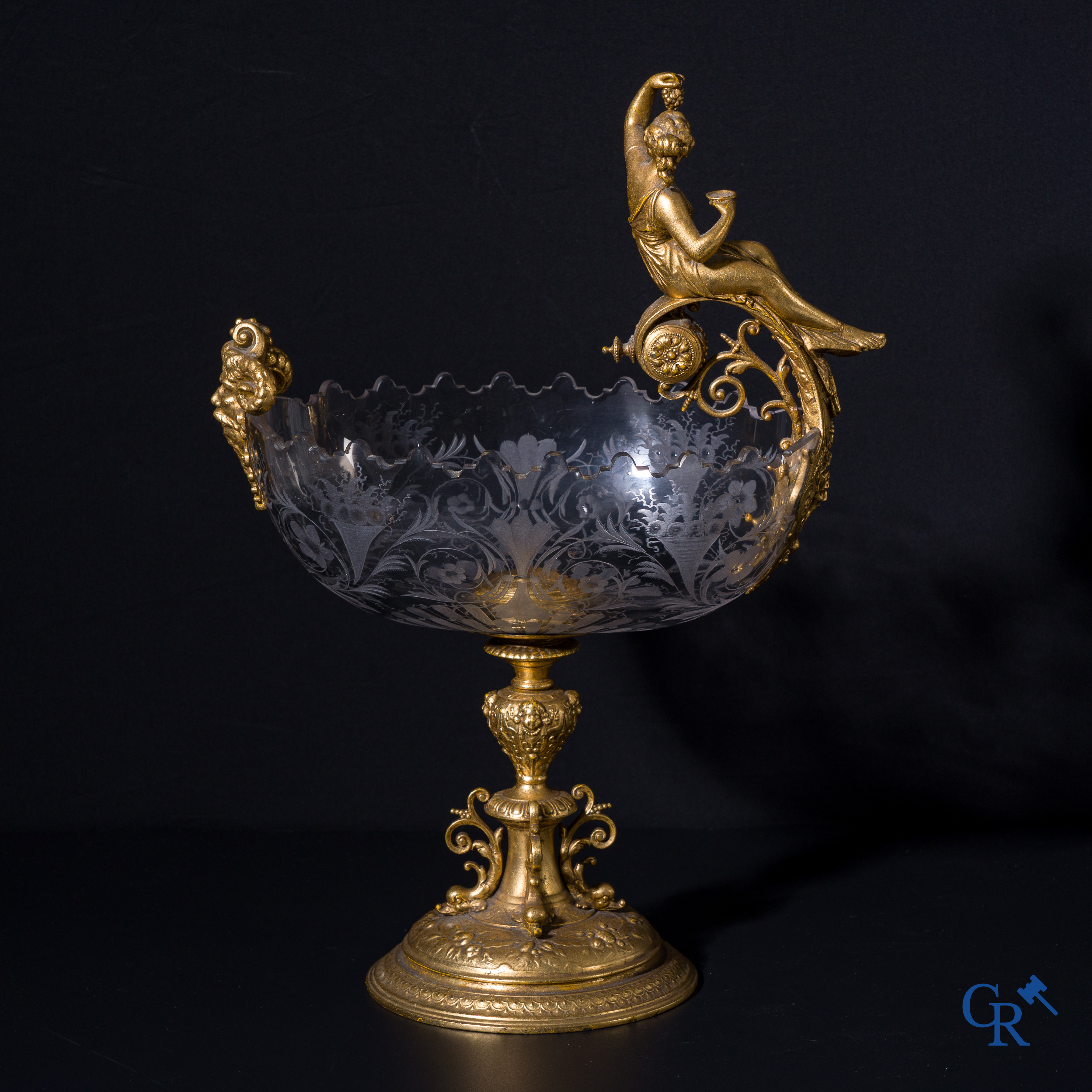 A gilded Renaissance-style table centerpiece with a richly cut crystal coupe. Late 19th century.