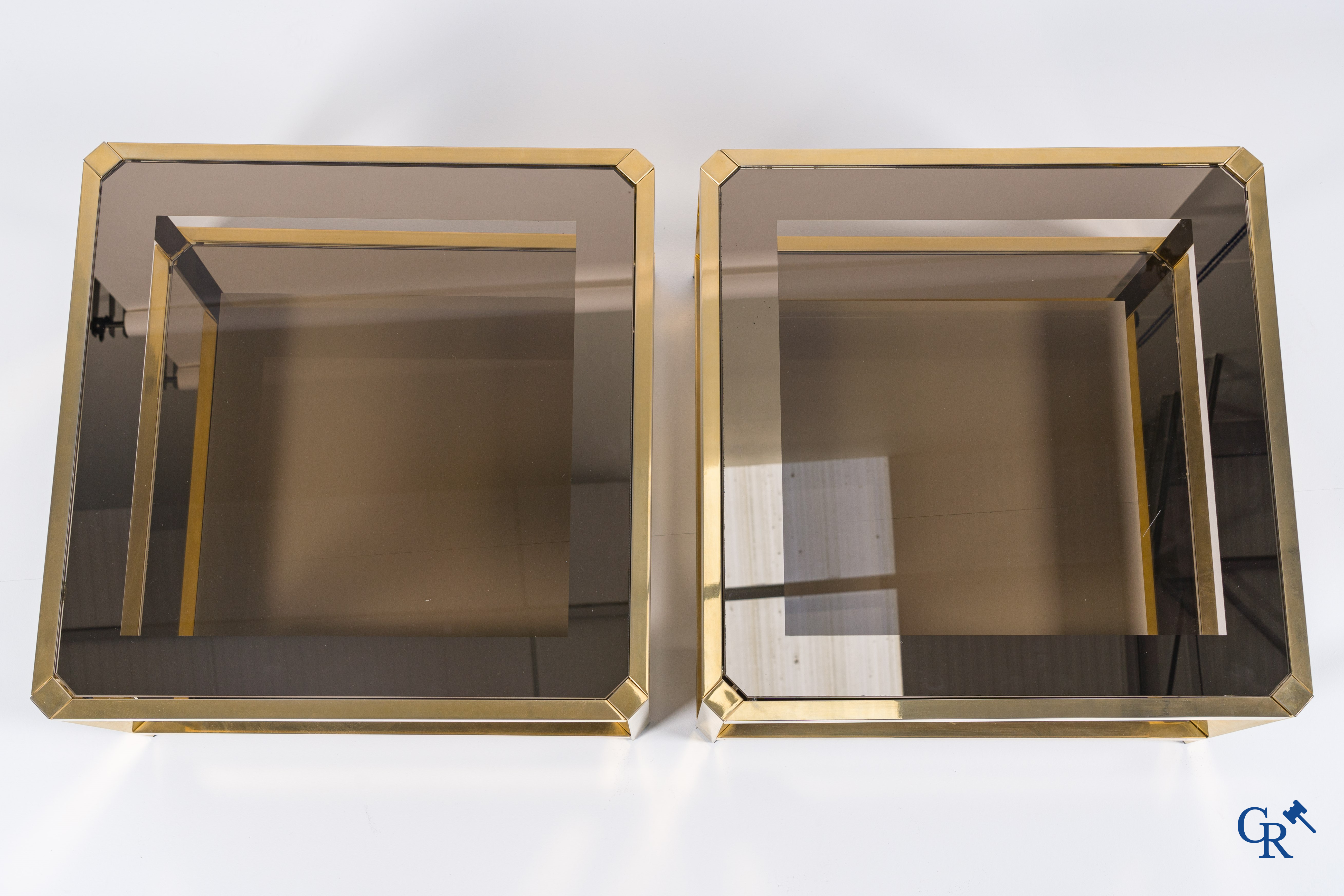 Design: Belgochrom, a pair of side tables (bouts de canapé) in gold-plated brass and glass, circa 1980.